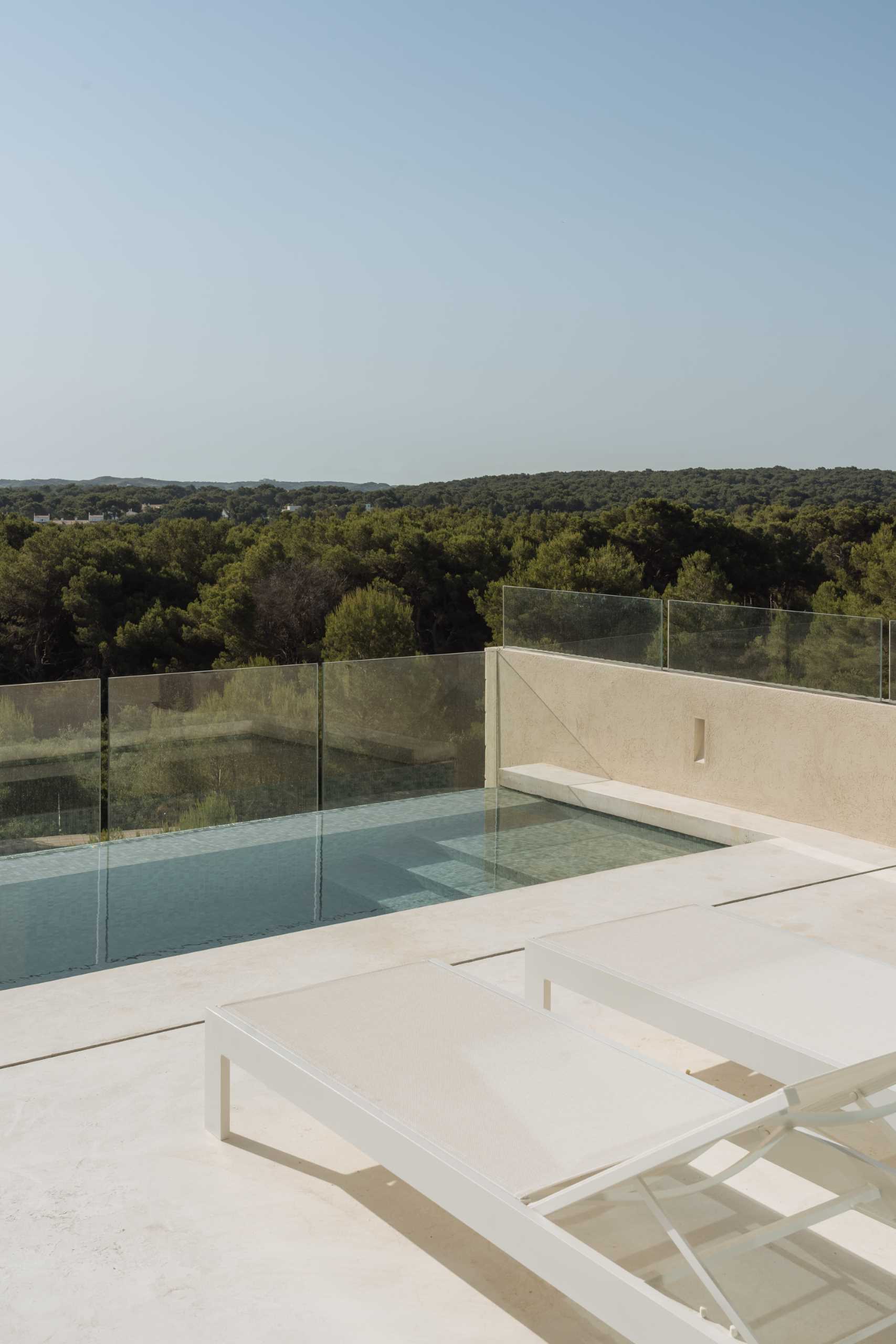 A modern home with an elevated swimming pool.