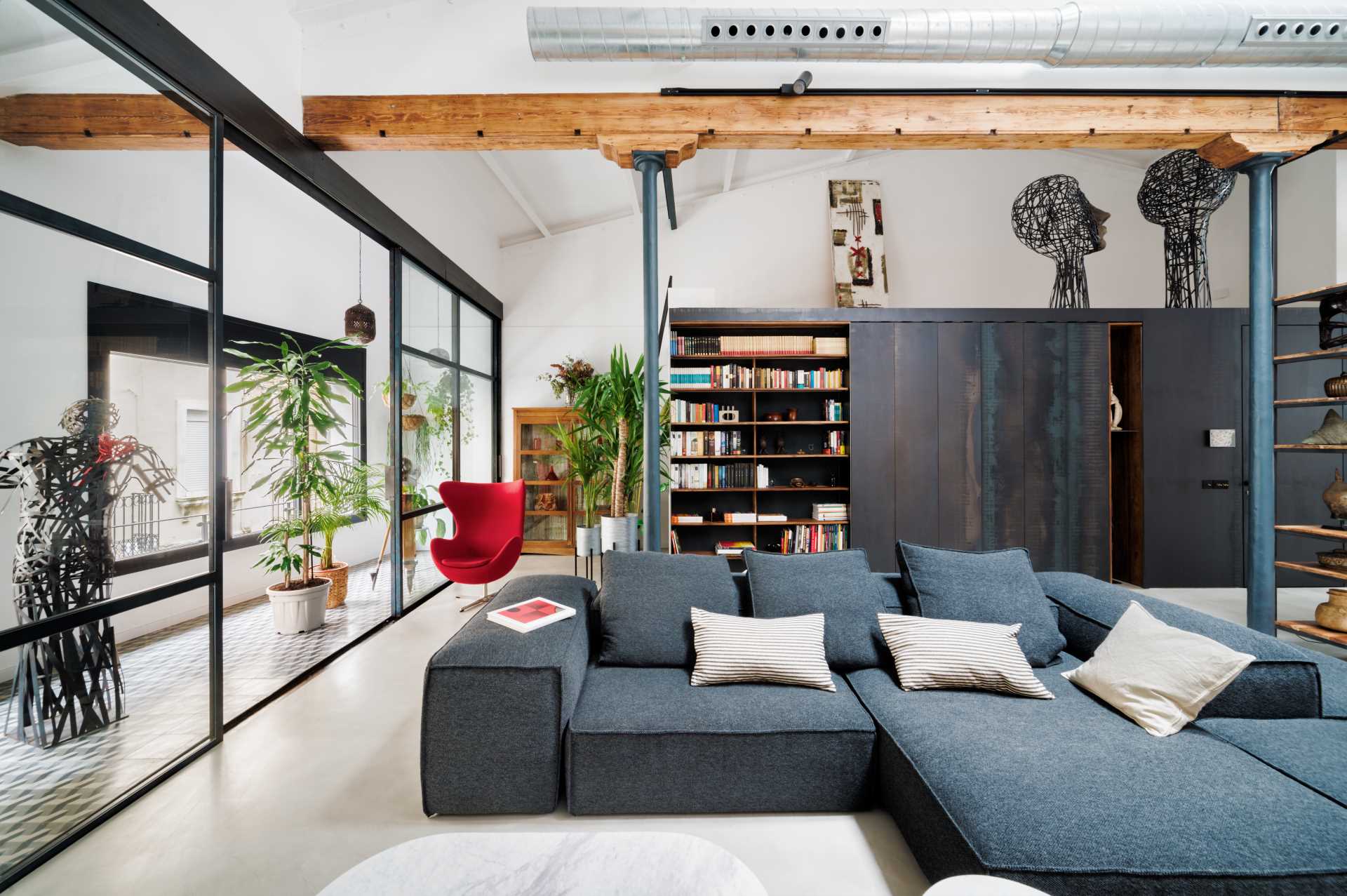 In the living room, there are gable ceilings over 19 feet (6m) high at the central point, and in front of the windows, a closed gallery with three iron and glass doors was installed. 