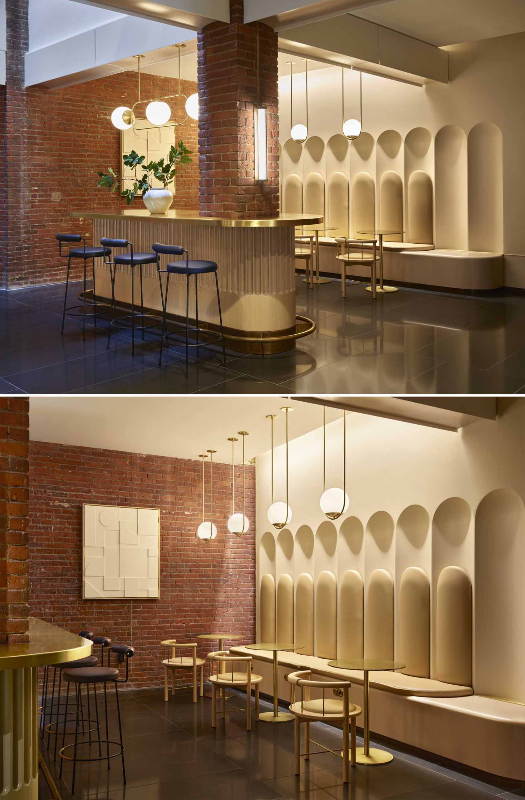A contemporary lobby in an office building with original brick walls and arched geometry.