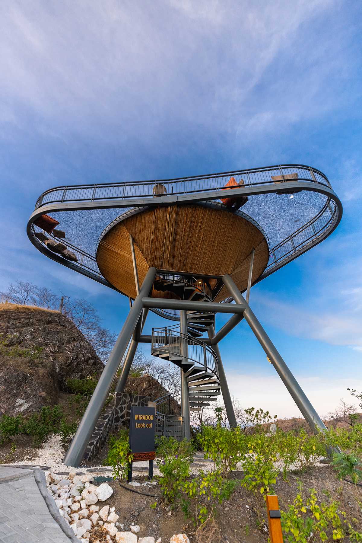 The Mirador Lookout in Costa Rica has spiral stairs that lead up to a platform that's surrounded by netting, creating a place to relax and enjoy the view.