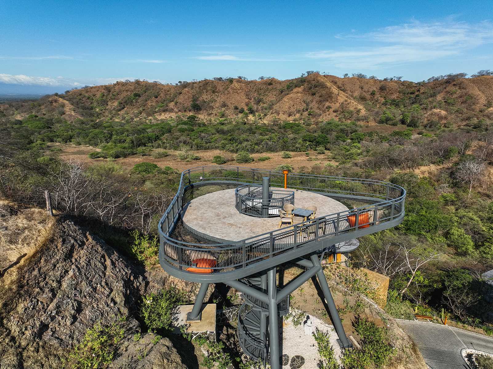 The Mirador Lookout in Costa Rica has spiral stairs that lead up to a platform that's surrounded by netting, creating a place to relax and enjoy the view.