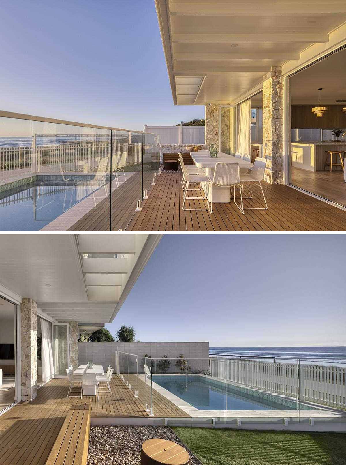 A modern coastal home with a designated outdoor space area for sitting, dining, and a swimming pool.