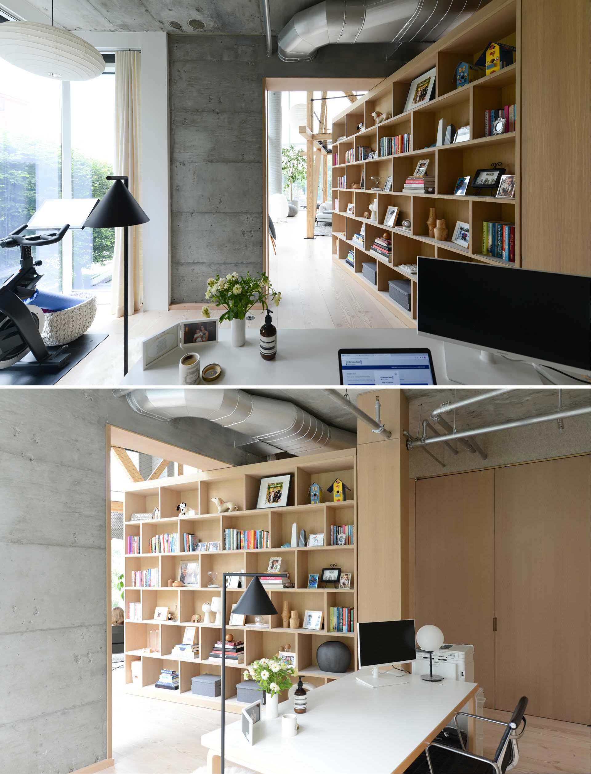 A home office is hidden from the living room behind an oversized pivoting bookshelf.