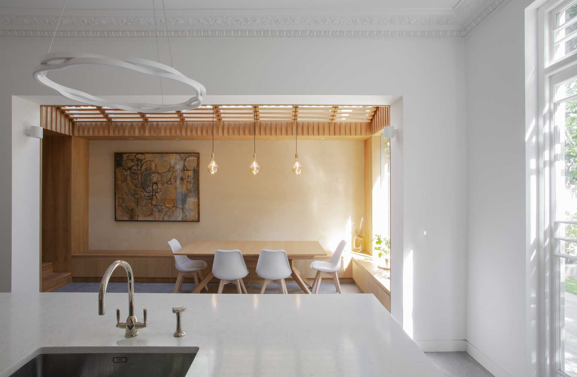 A remodeled home removed a wall to create an open dining area and kitchen.