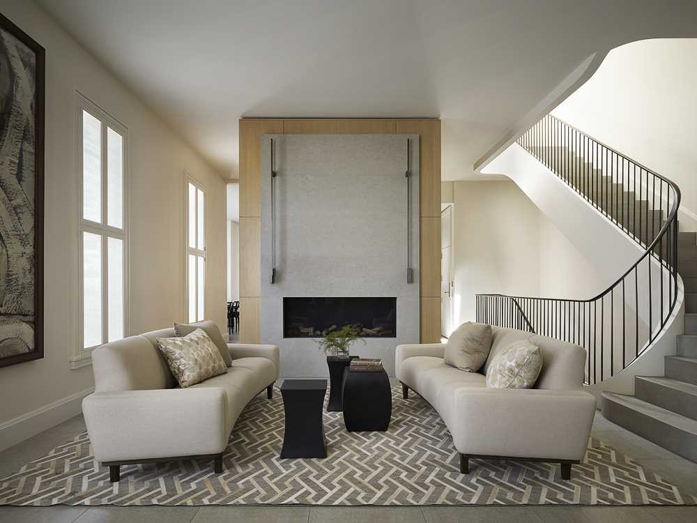 A contemporary sitting room with a fireplace.