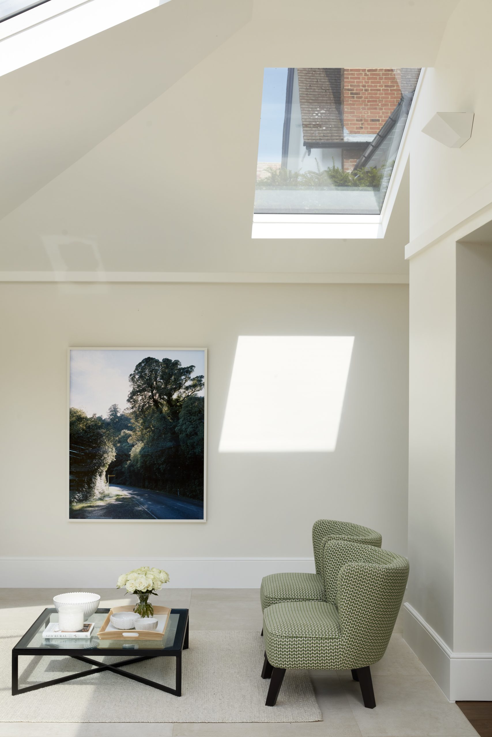 An updated brick extension for an Edwardian home includes a sitting area with a skylight.