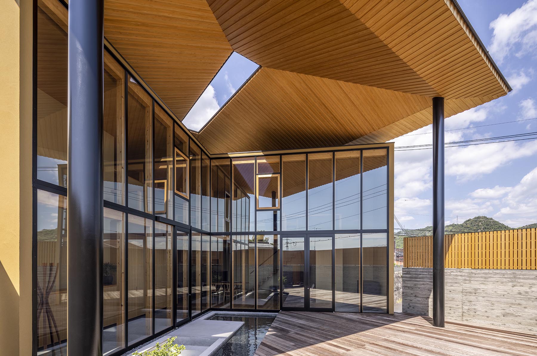 Modern house with wood, glass, and metal.