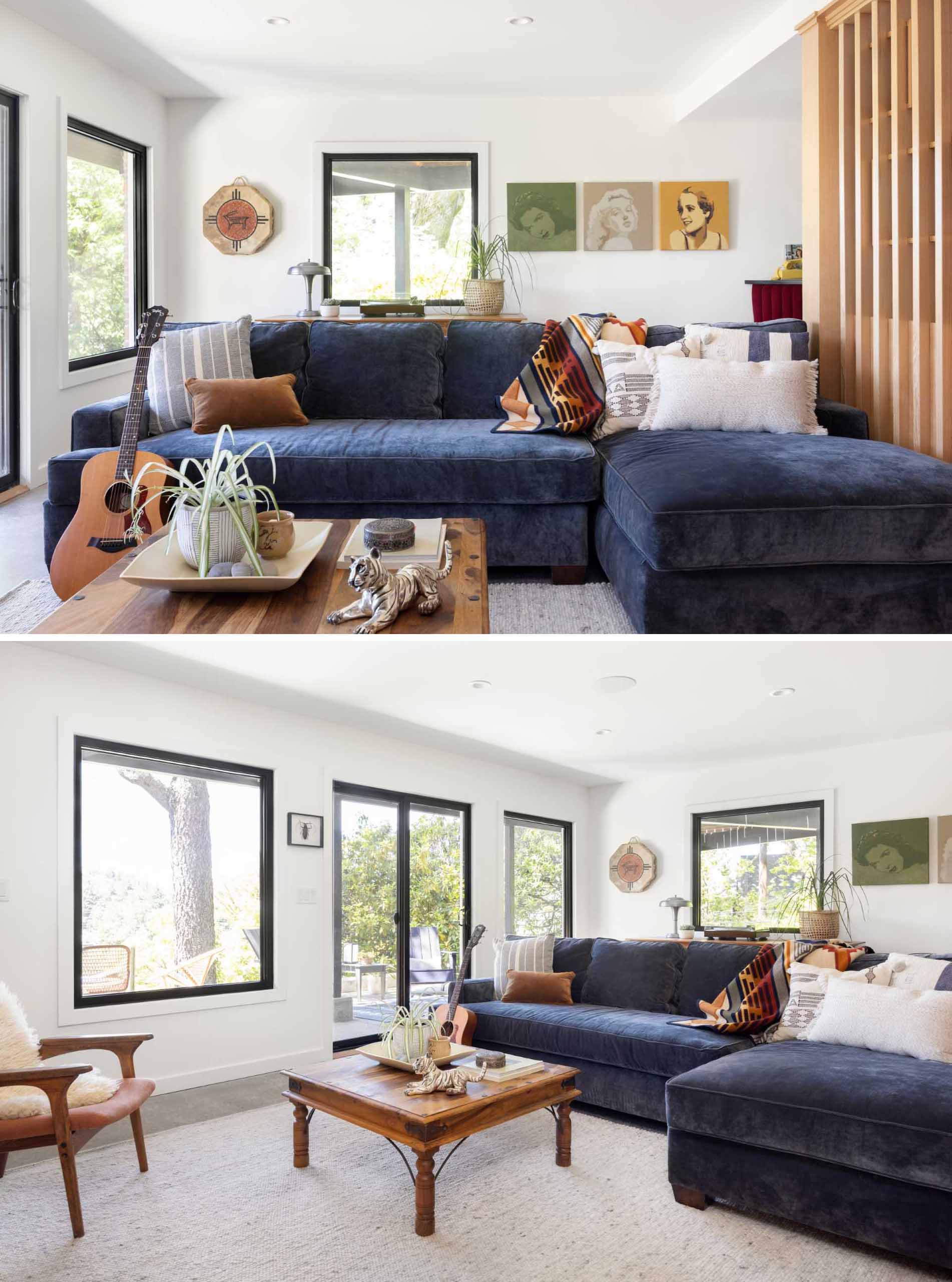 A modern family room with a blue couch.