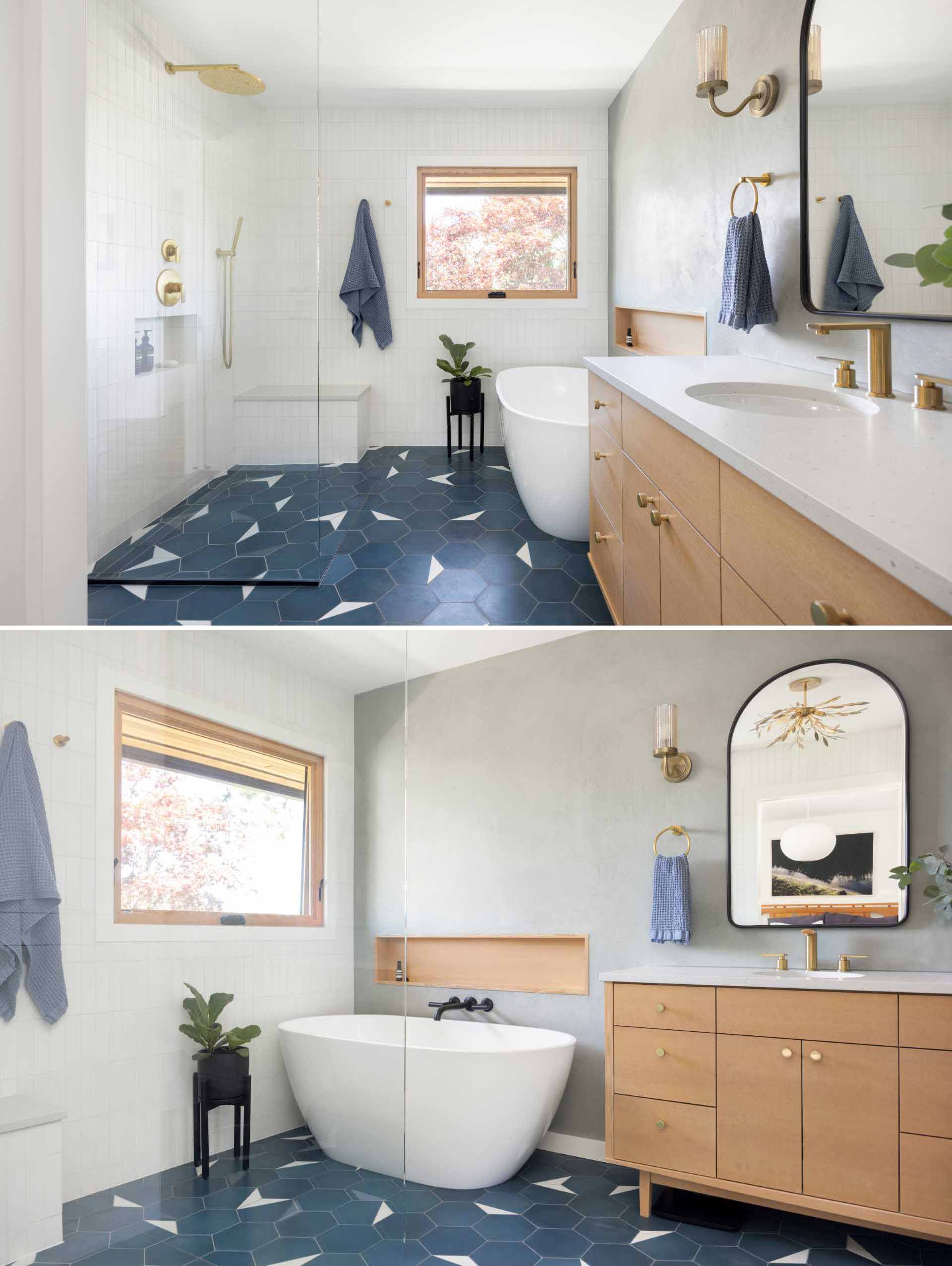 This ensuite bathroom includes a mid-century modern inspired tile flooring, a walk-in shower with a bench, white tiled walls, a freestanding bathtub with wood shelving niche, and a wood vanity.