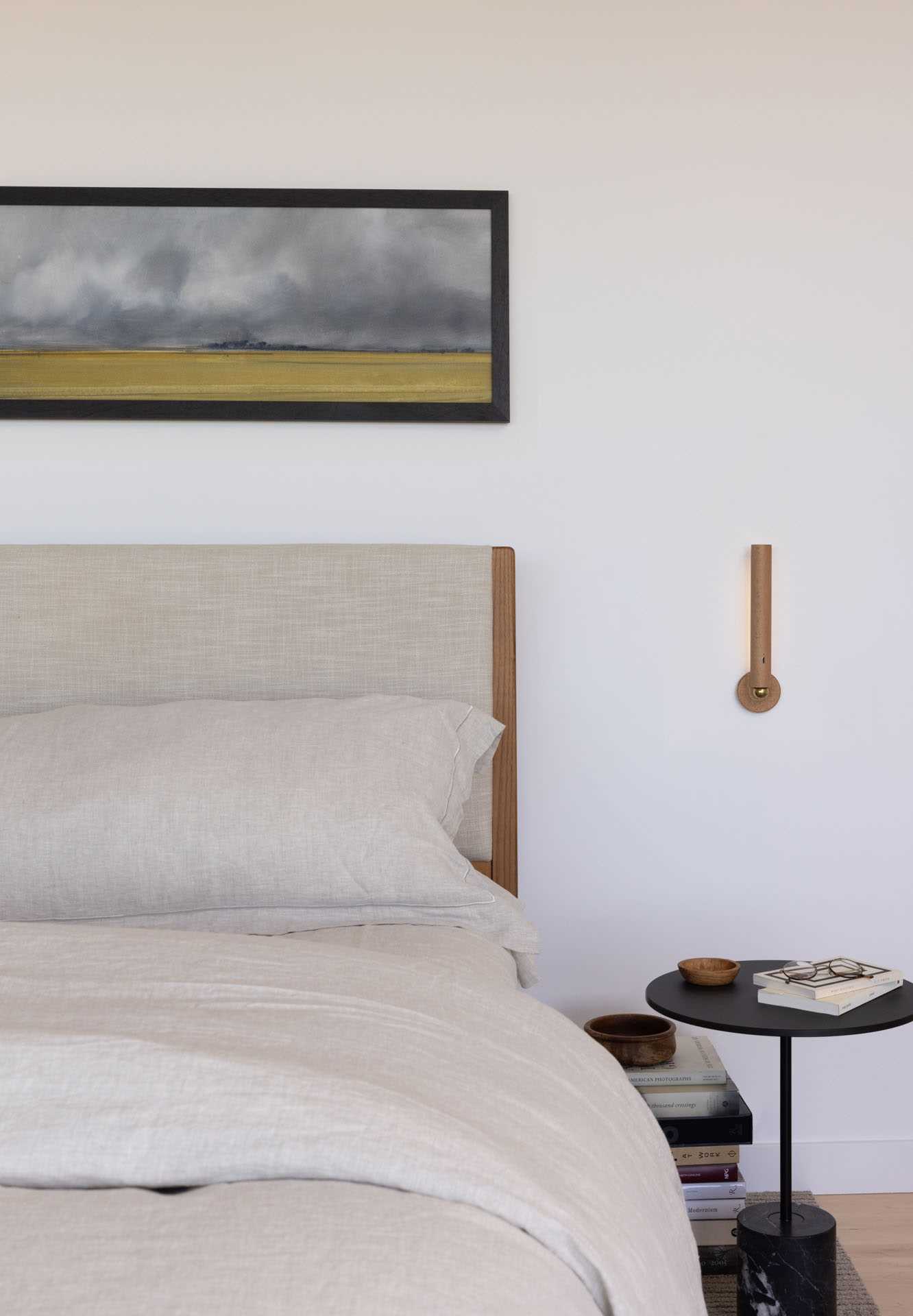 A modern bedroom design with minimalist wall scones.