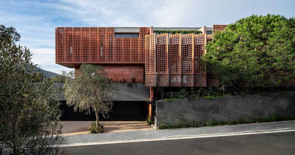 Red-Pigmented Concrete Screens Surround This New Home In Cape Town