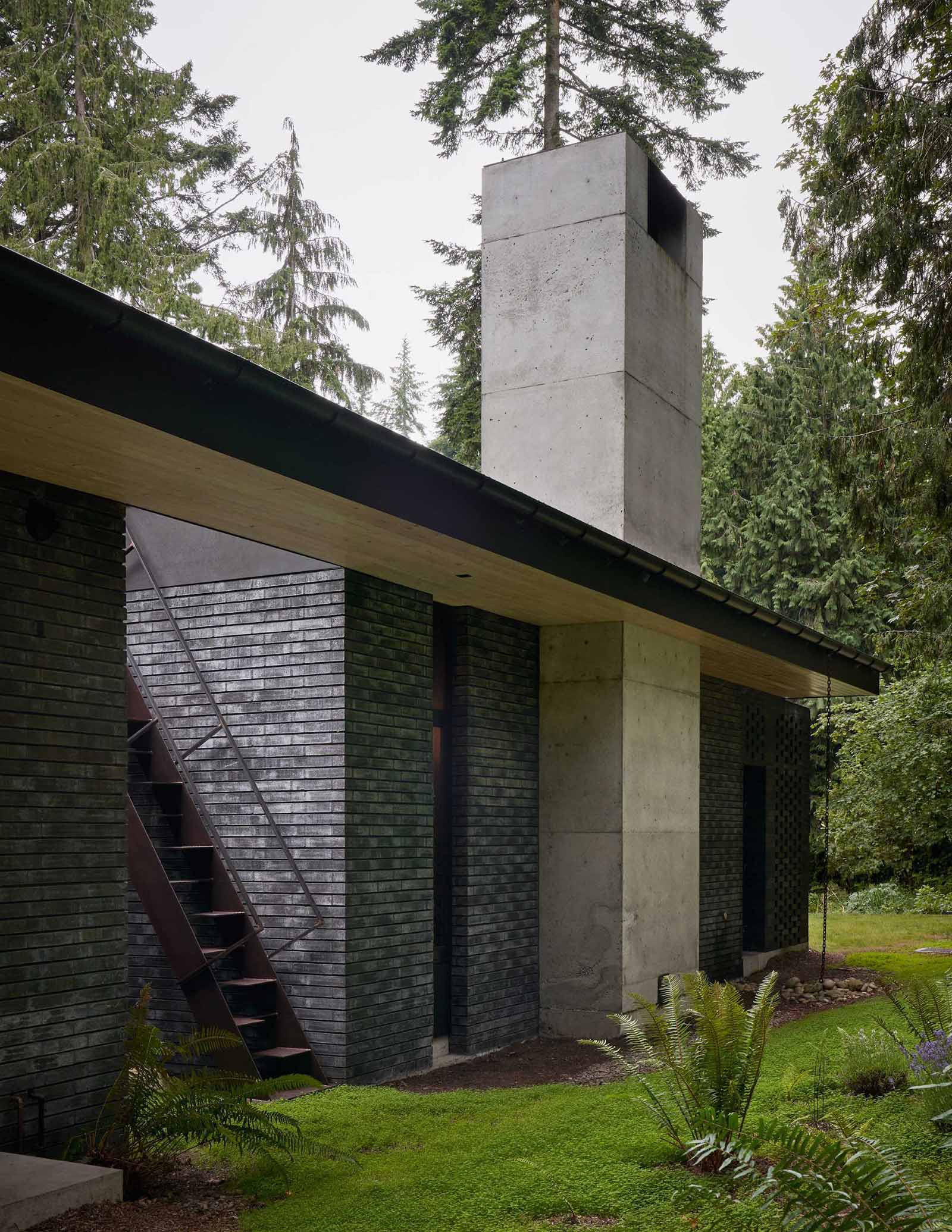 This modern home has a rooftop that's set up for star gazing and an elevated herb garden that's accessible via steel stairs.