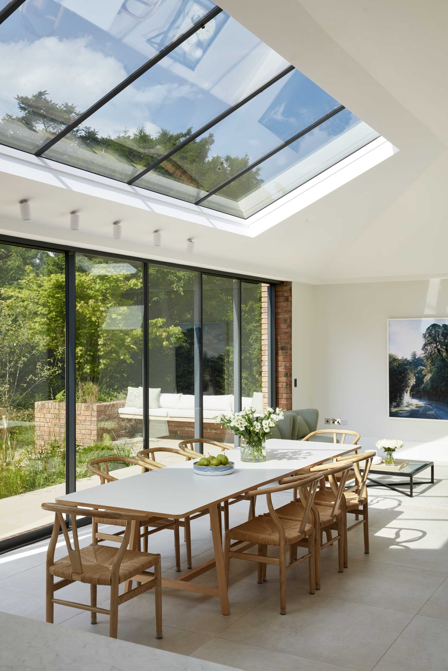 An updated brick extension for an Edwardian home includes a sitting area and dining area for eight people.