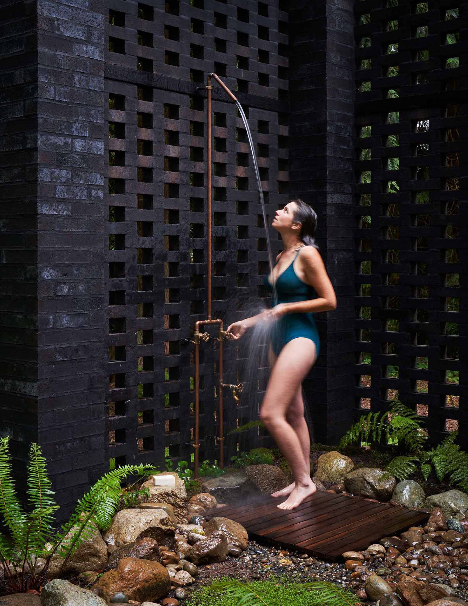 A modern home with an outdoor shower.