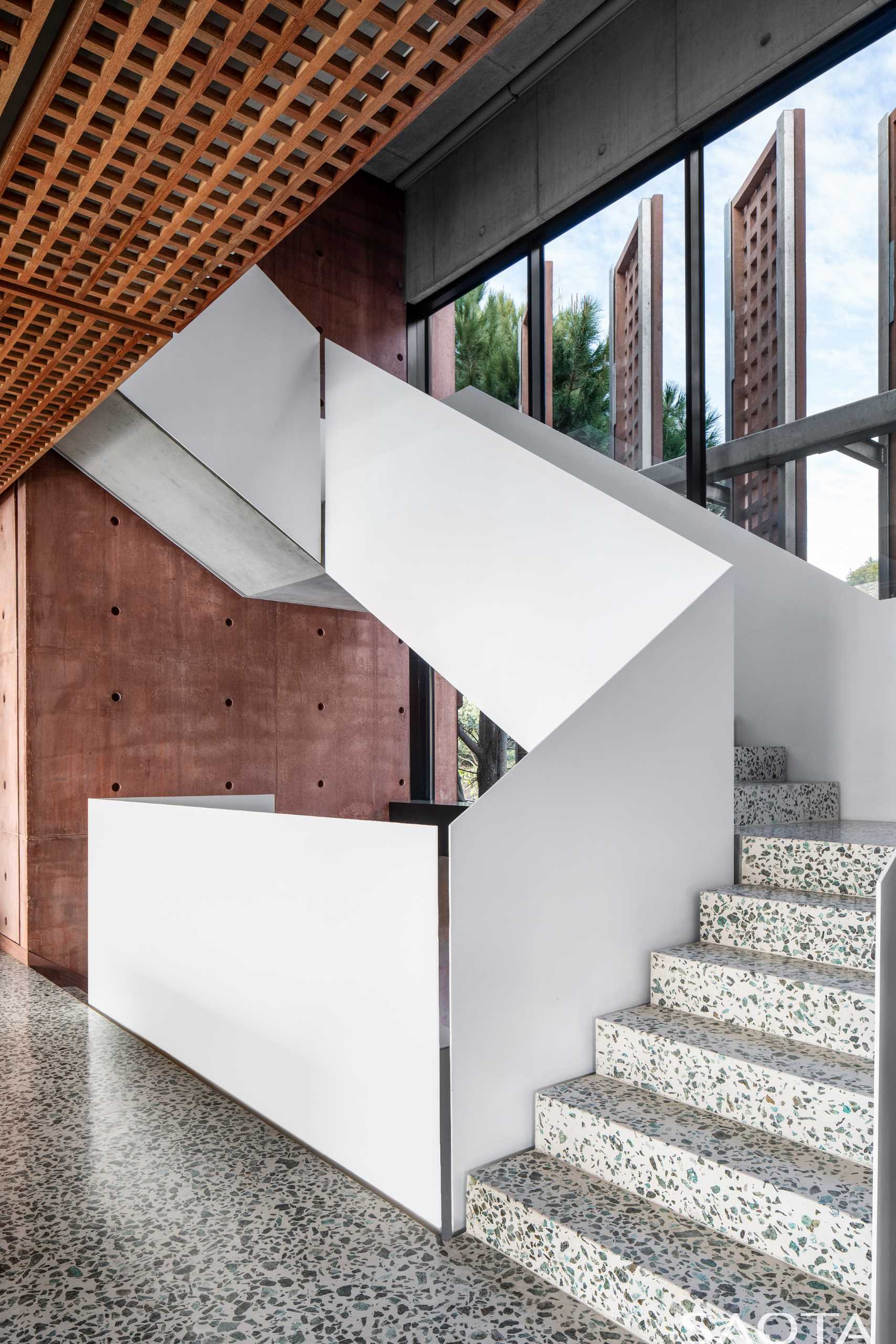 A staircase with a polished polymer concrete floor.