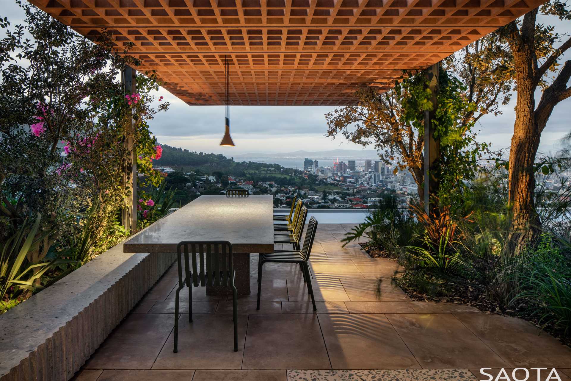 An outdoor dining area with plants.