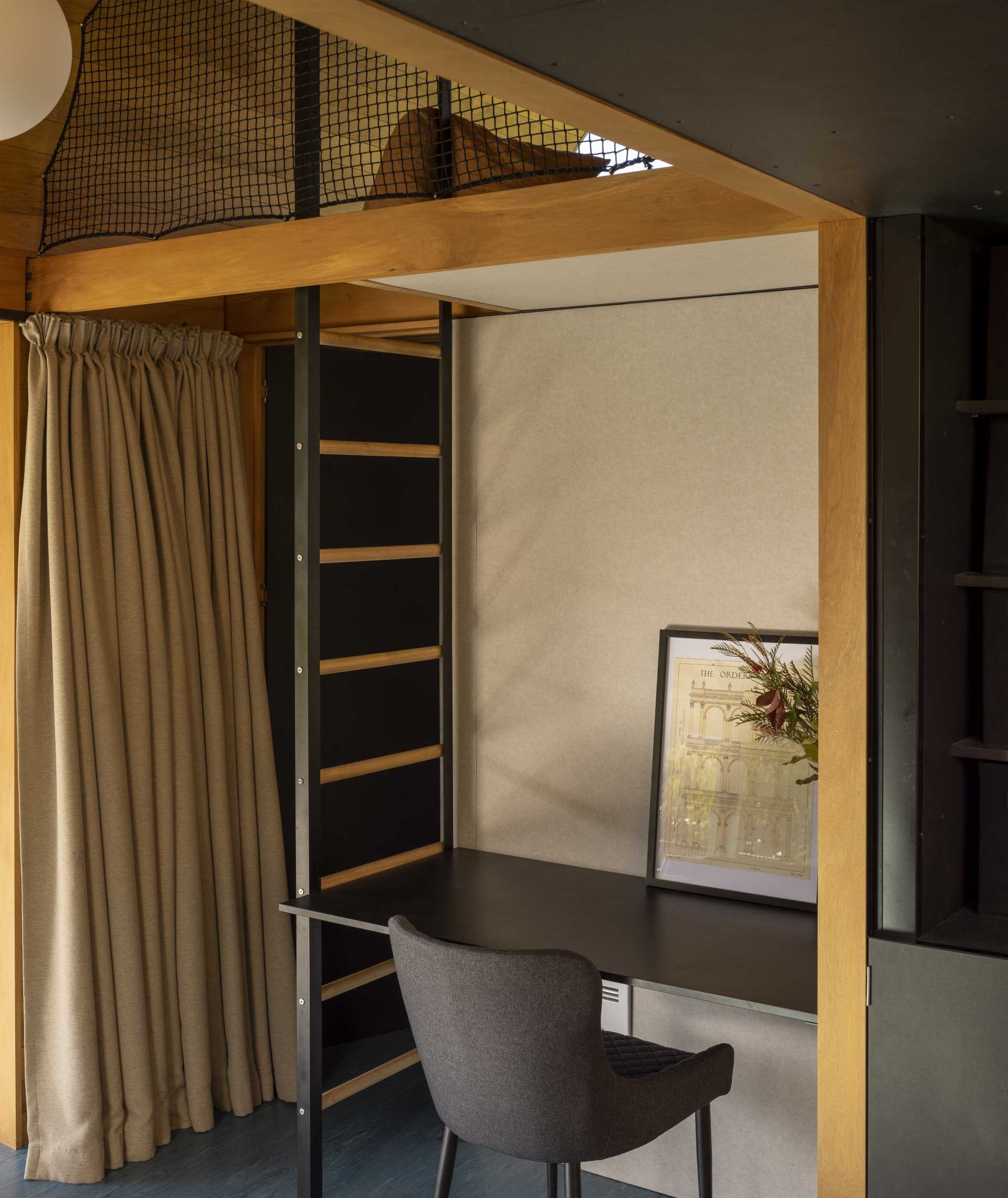 A study and reading loft in a small one-bedroom home.