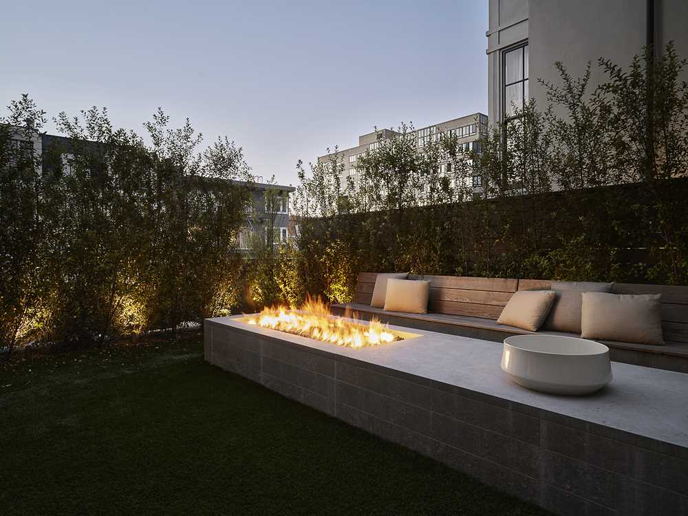 An outdoor seating area with a firepit.