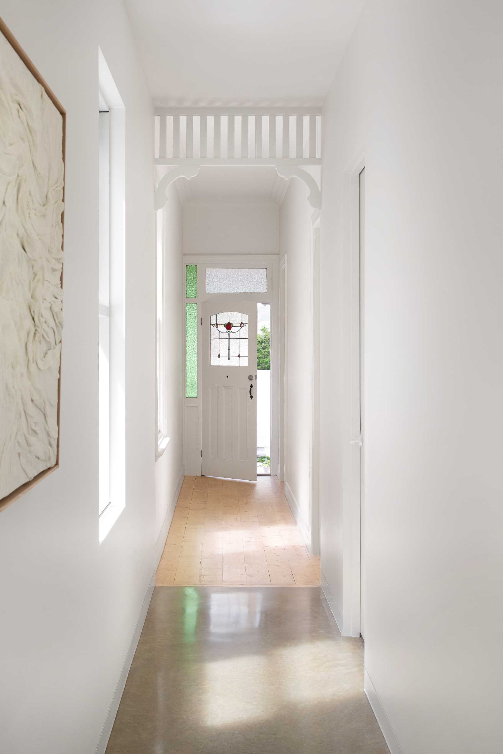 The entry hallway connects the original part of the home with the new extension.