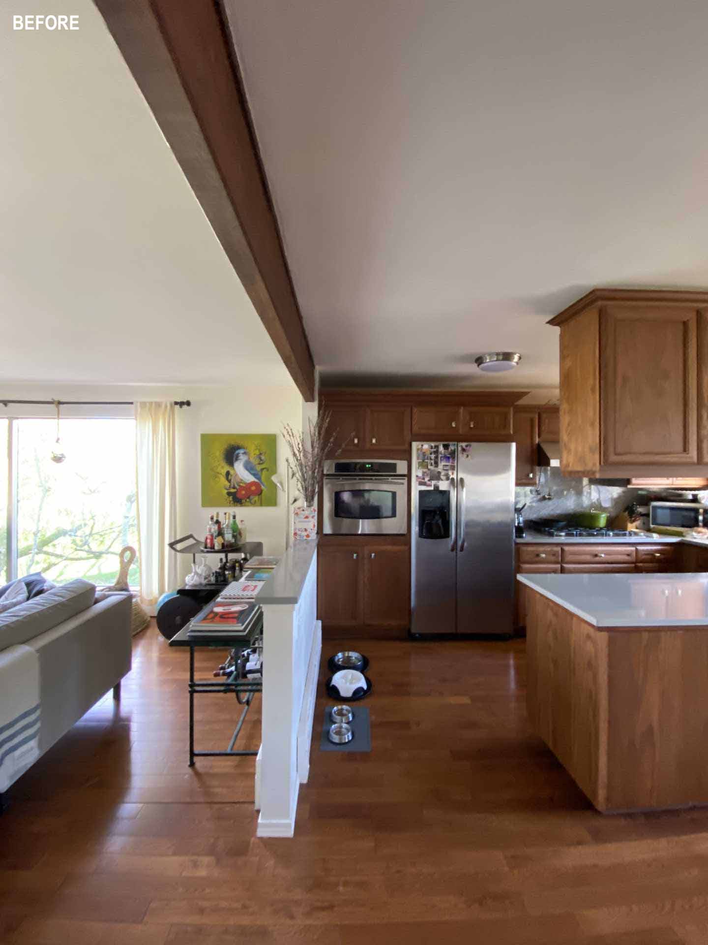 Before photos - A dark wood kitchen before receiving a contemporary remodel.