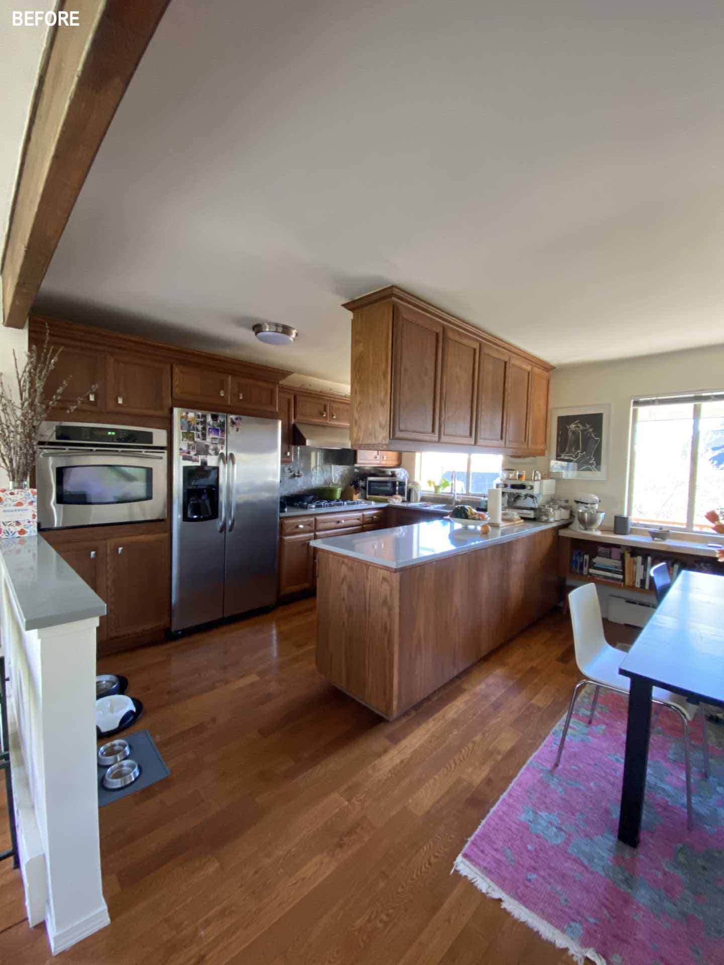 Before photos - A dark wood kitchen and dining area before receiving a contemporary remodel.