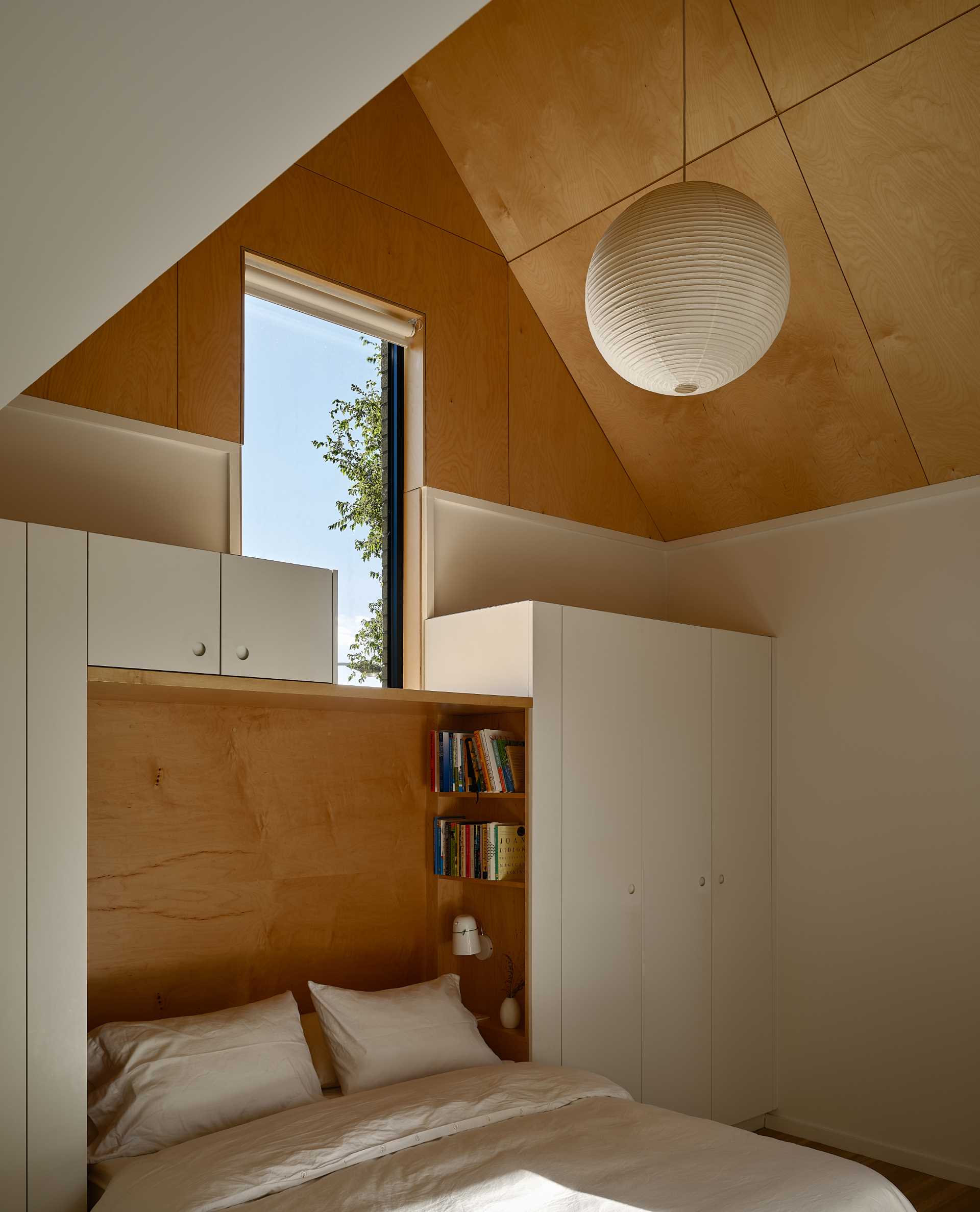 A modern bedroom with built-in closets.