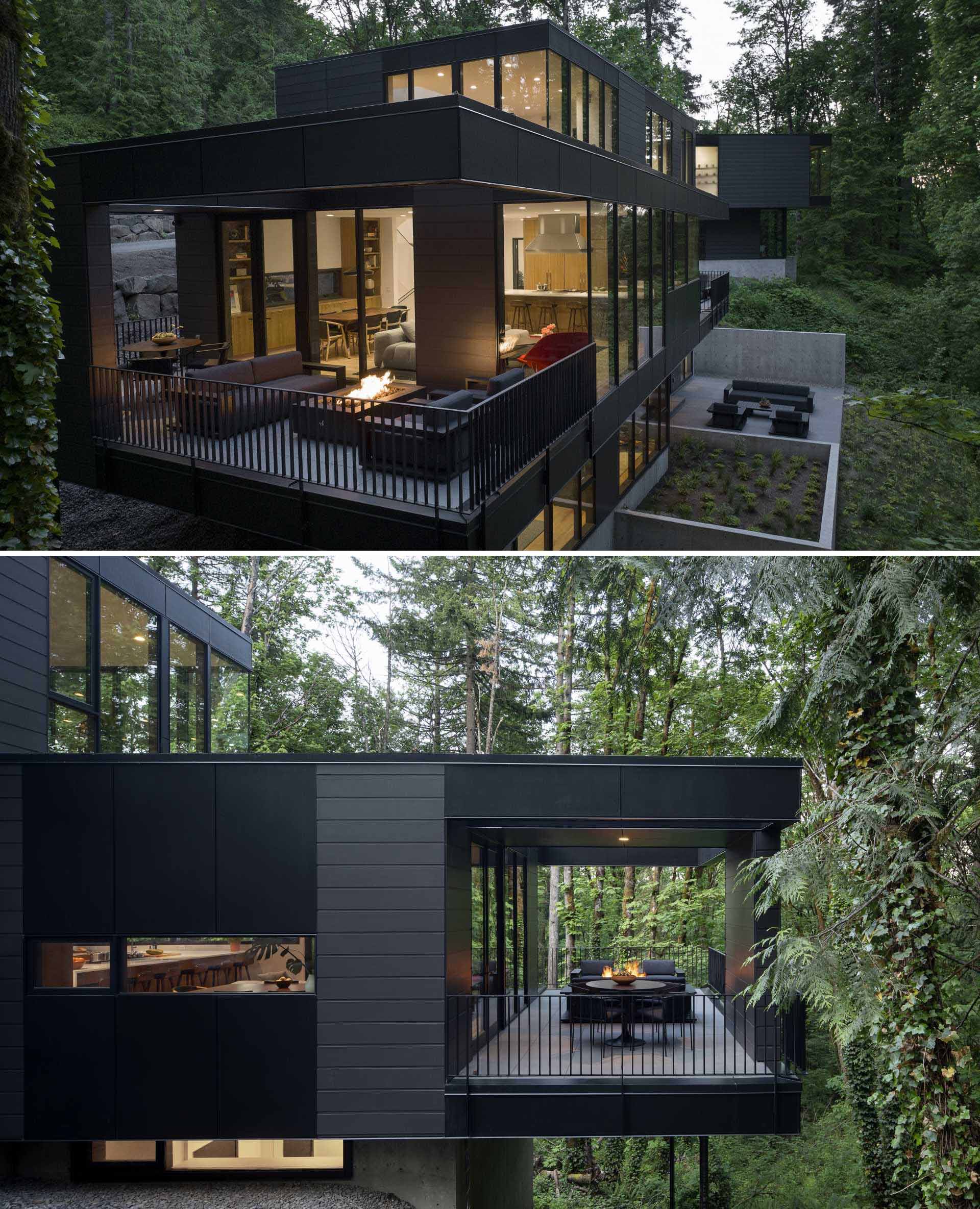 This modern house has a dining area that opens onto a terrace with an al fresco dining area and aluminum seating arranged around a substantial concrete fire table by RH.