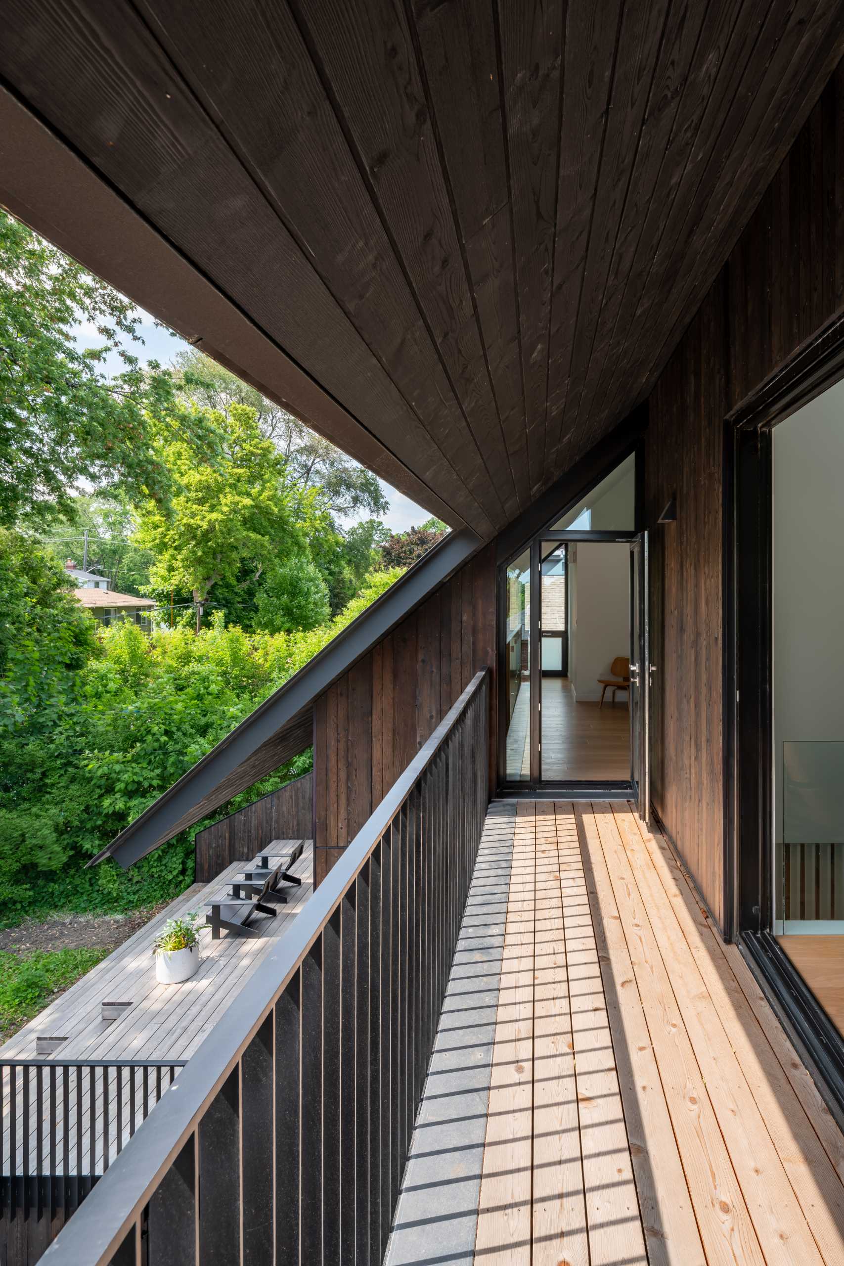 A partially covered balcony with a view of the backyard.