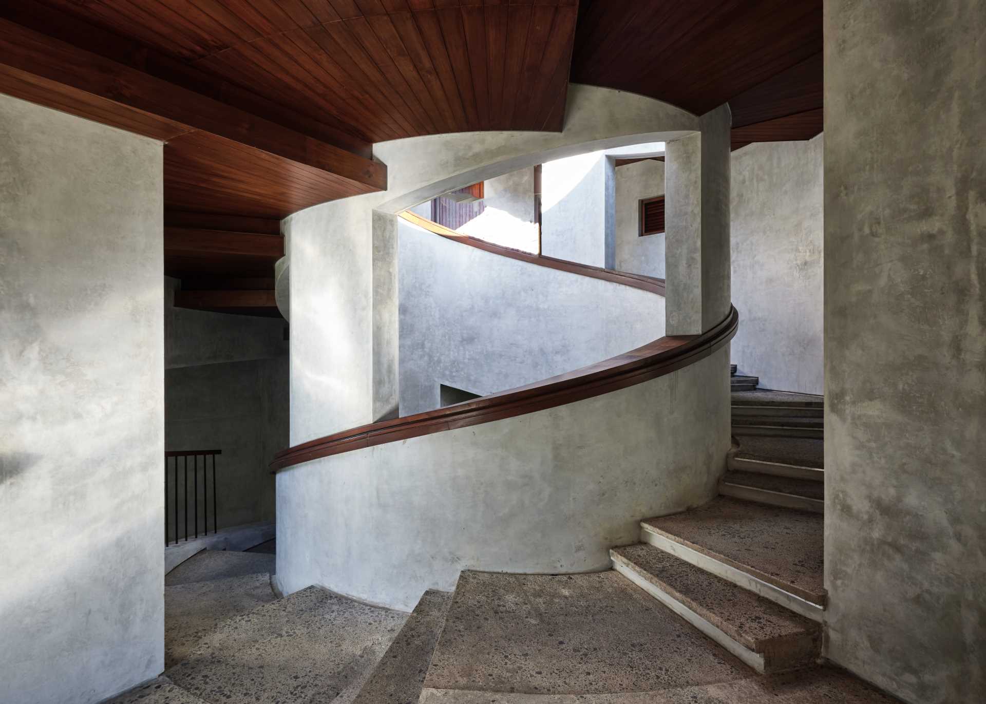 A modern house design with a pair of spiral staircases.