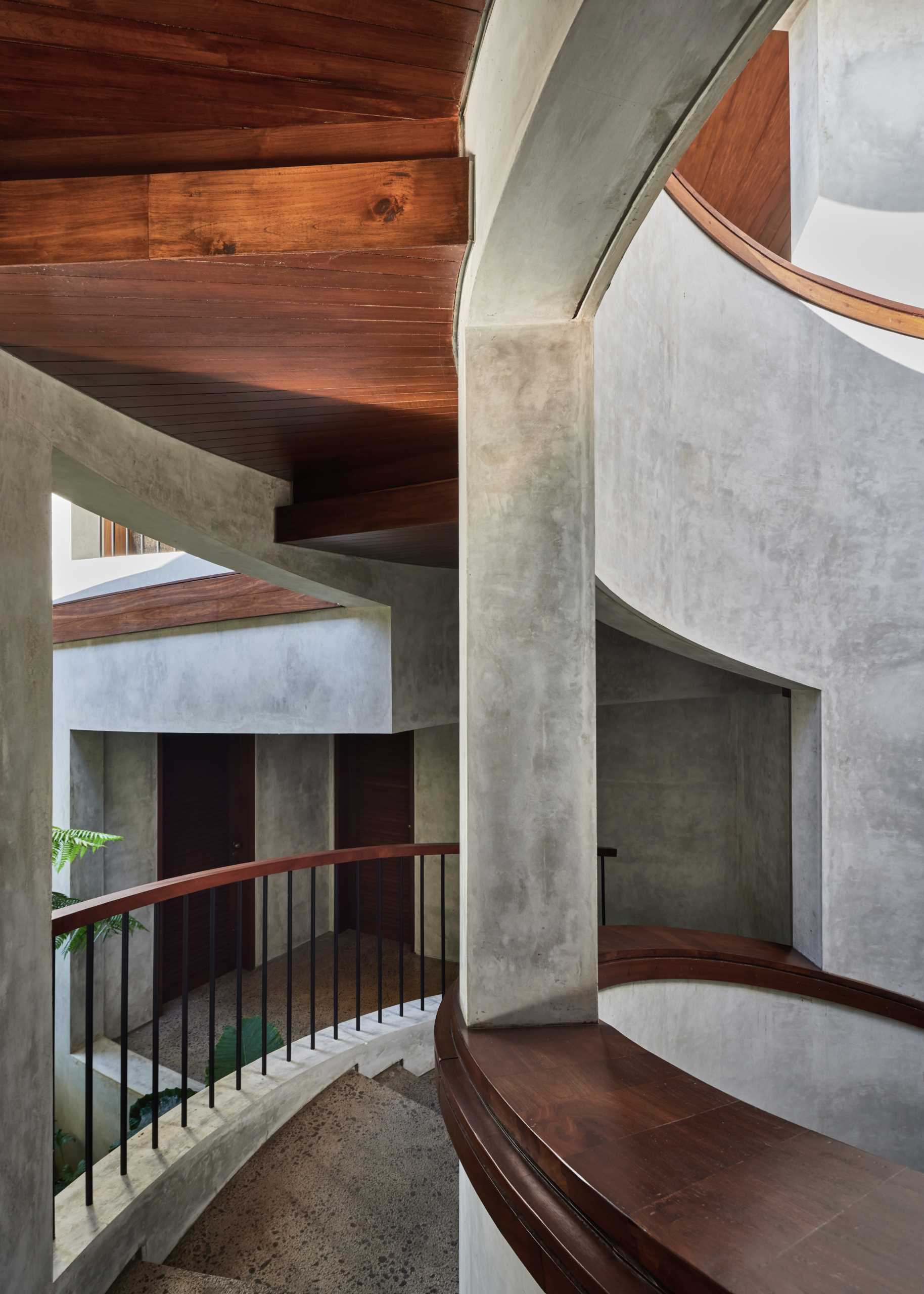 A modern house design with a pair of spiral staircases.