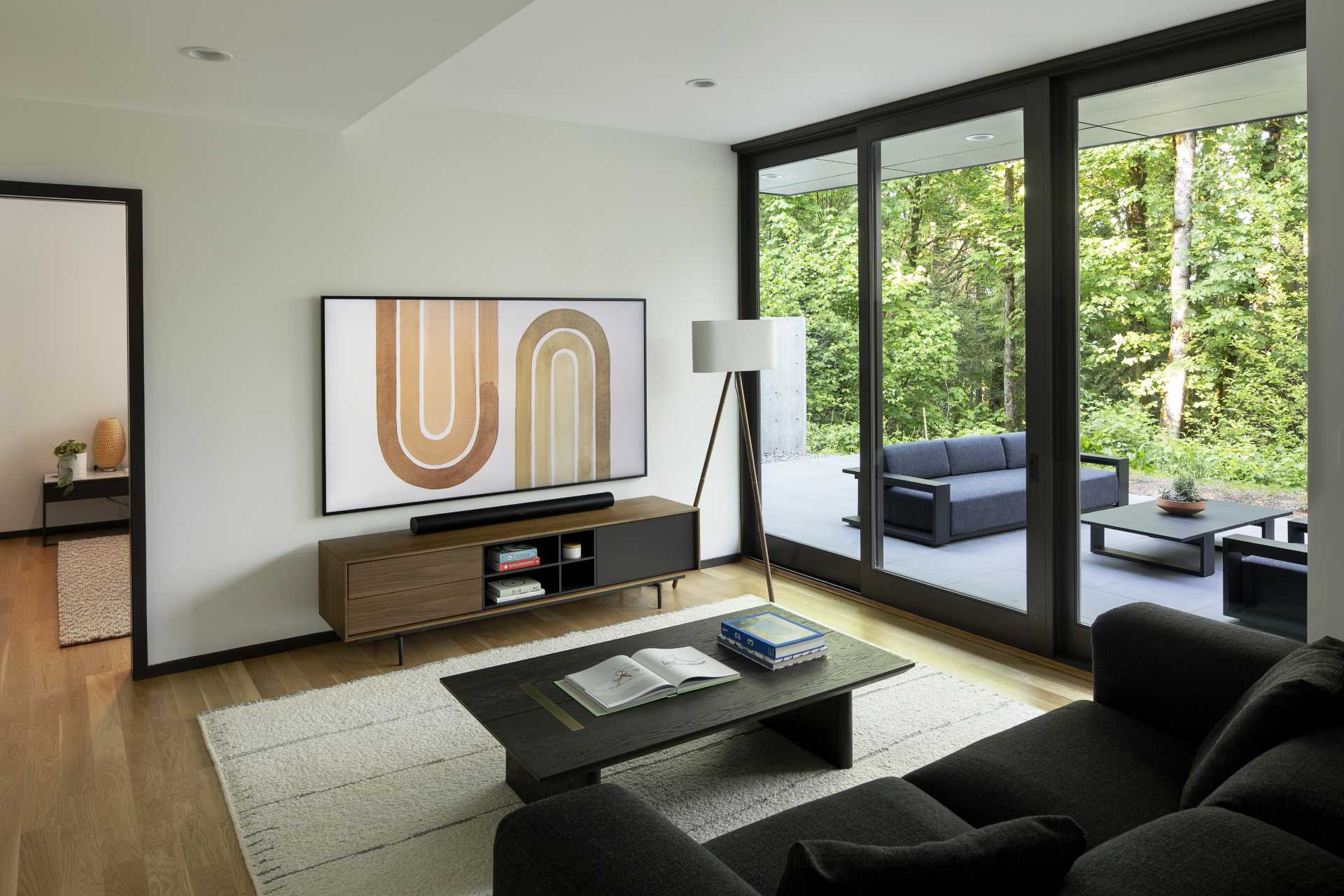 A modern living room that opens to a patio.