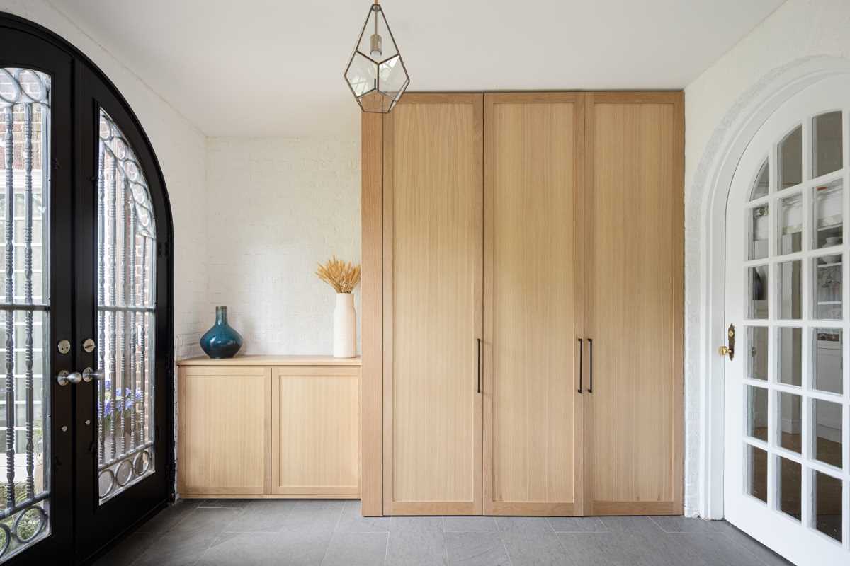 Entering this home, there's a mudroom with custom cabinetry providing ample storage.