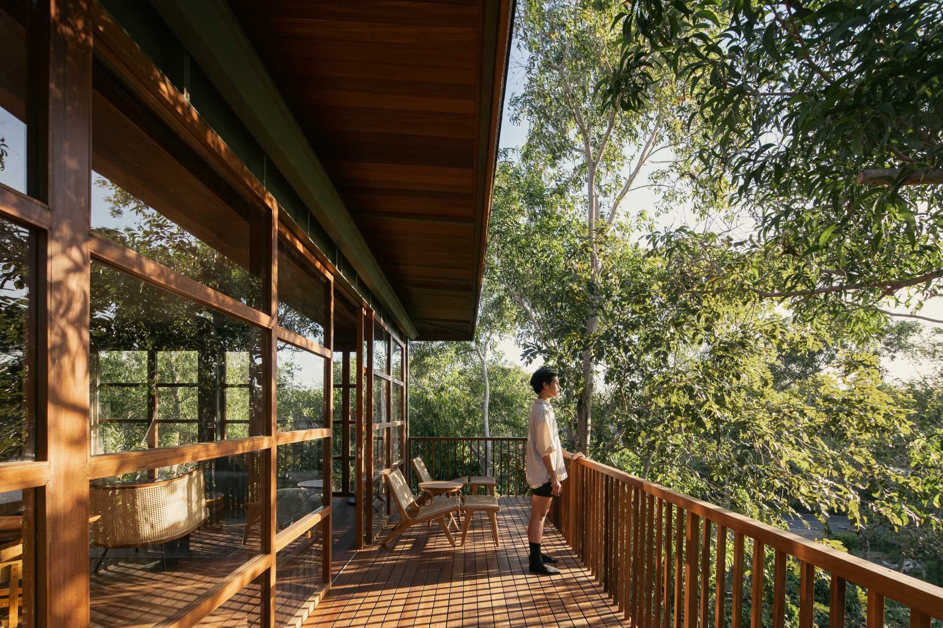 The balcony of a modern two-bedroom wood cabin.