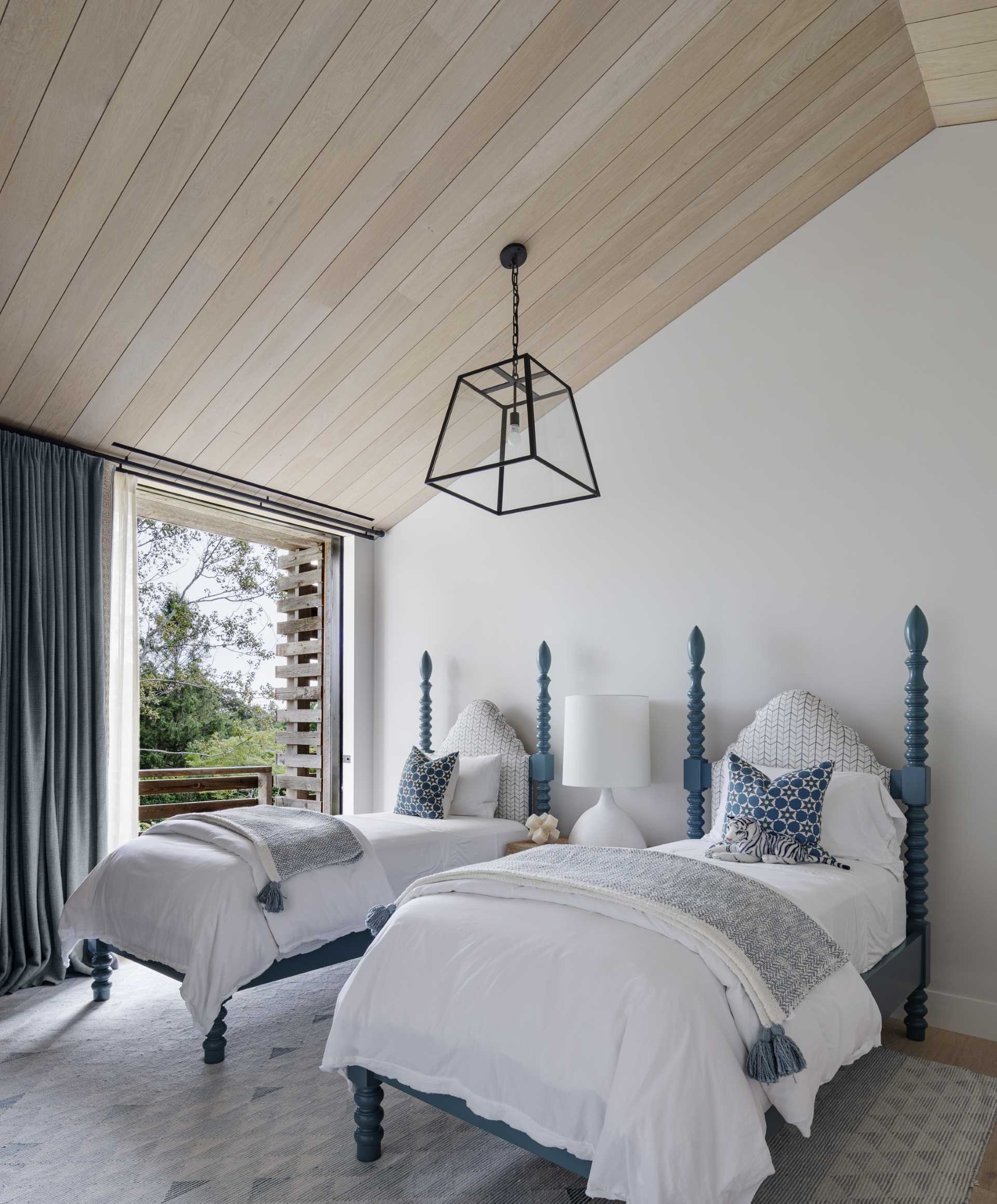 A contemporary bedroom with blue accents.