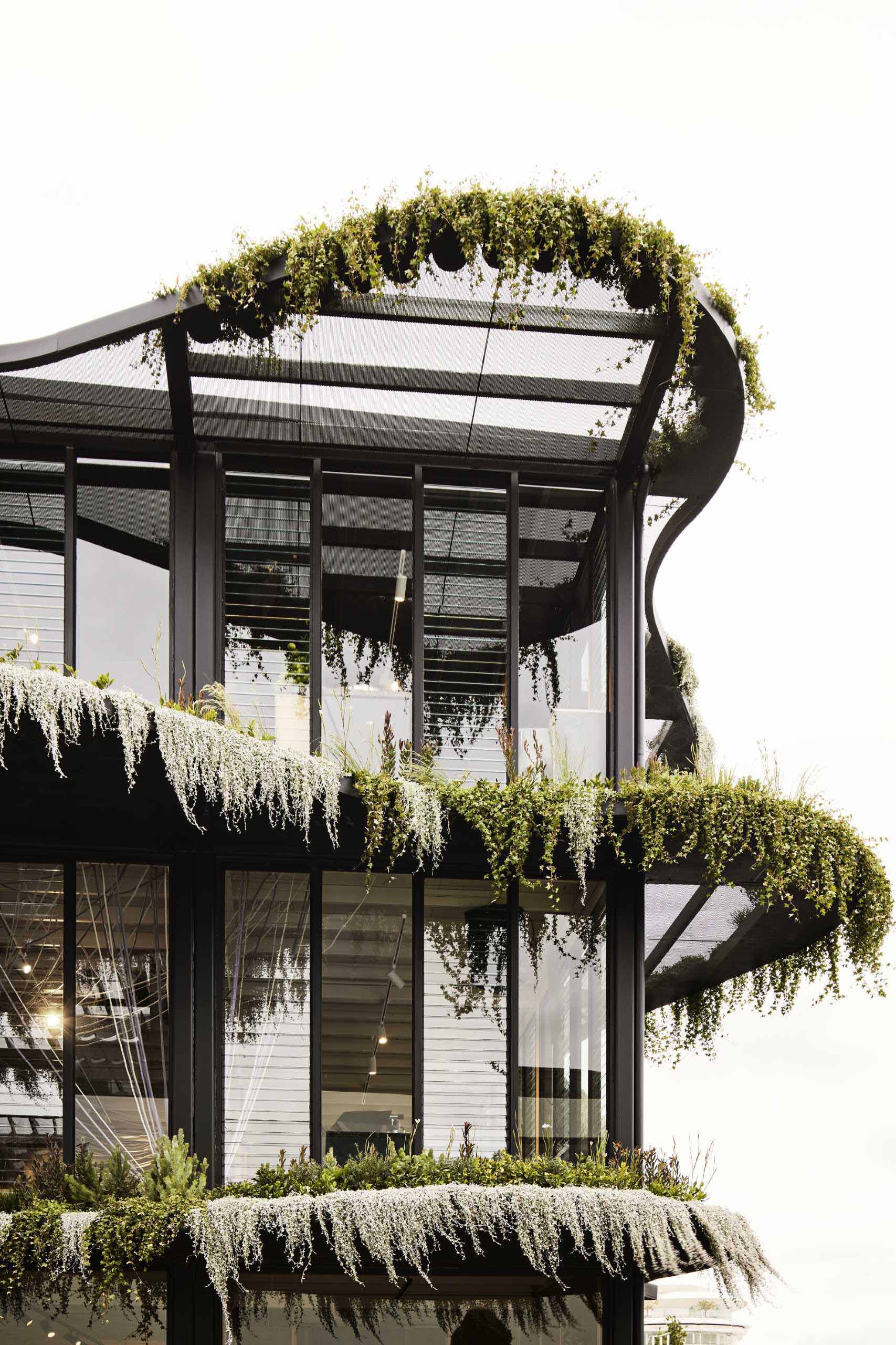 Drawing inspiration from the Australian landscape, Koichi Takada Architects designed a three-storey modular building that has over 1,000 native Australian plants and flowers on its facade.