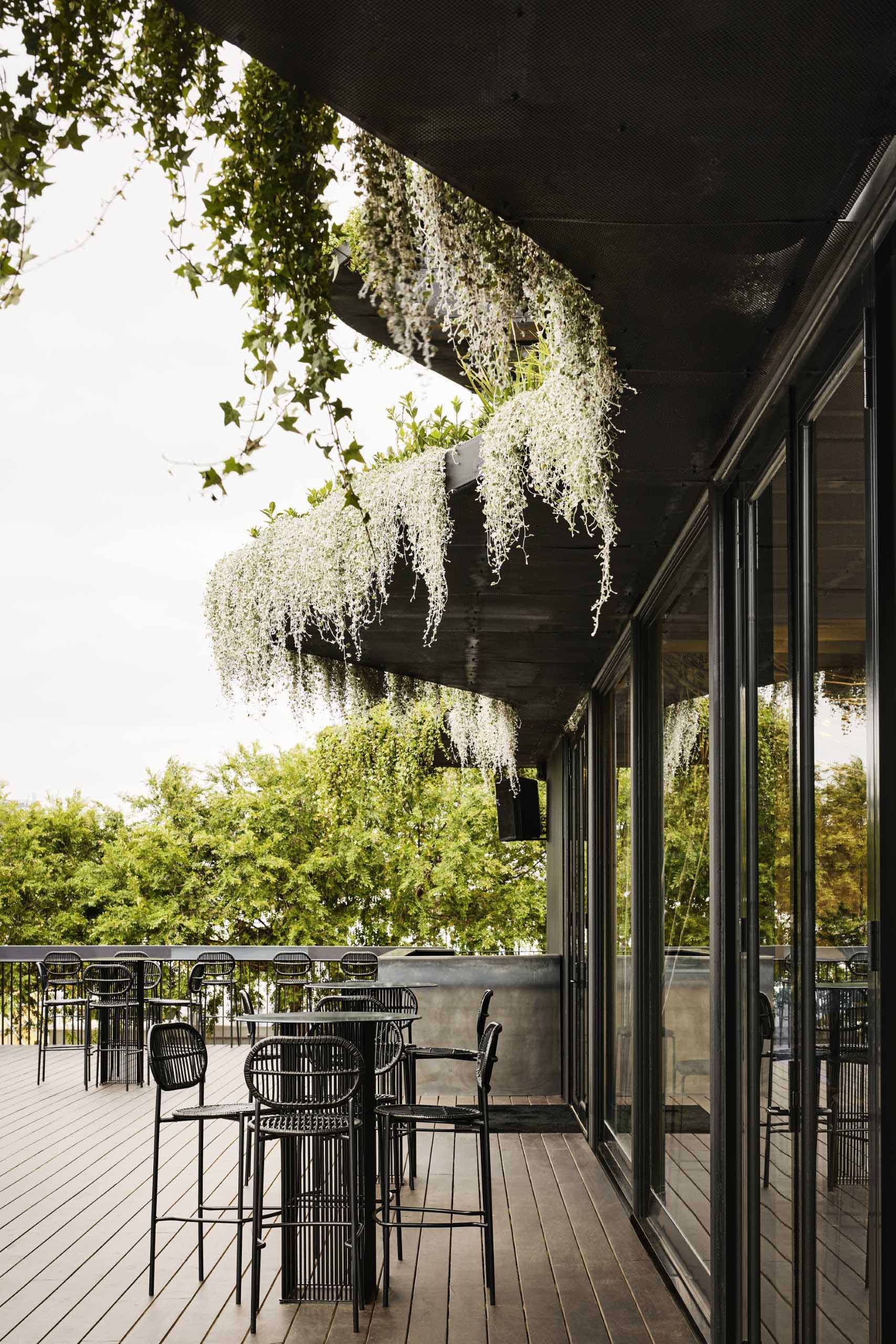 Drawing inspiration from the Australian landscape, Koichi Takada Architects designed a three-storey modular building that has over 1,000 native Australian plants and flowers on its facade.