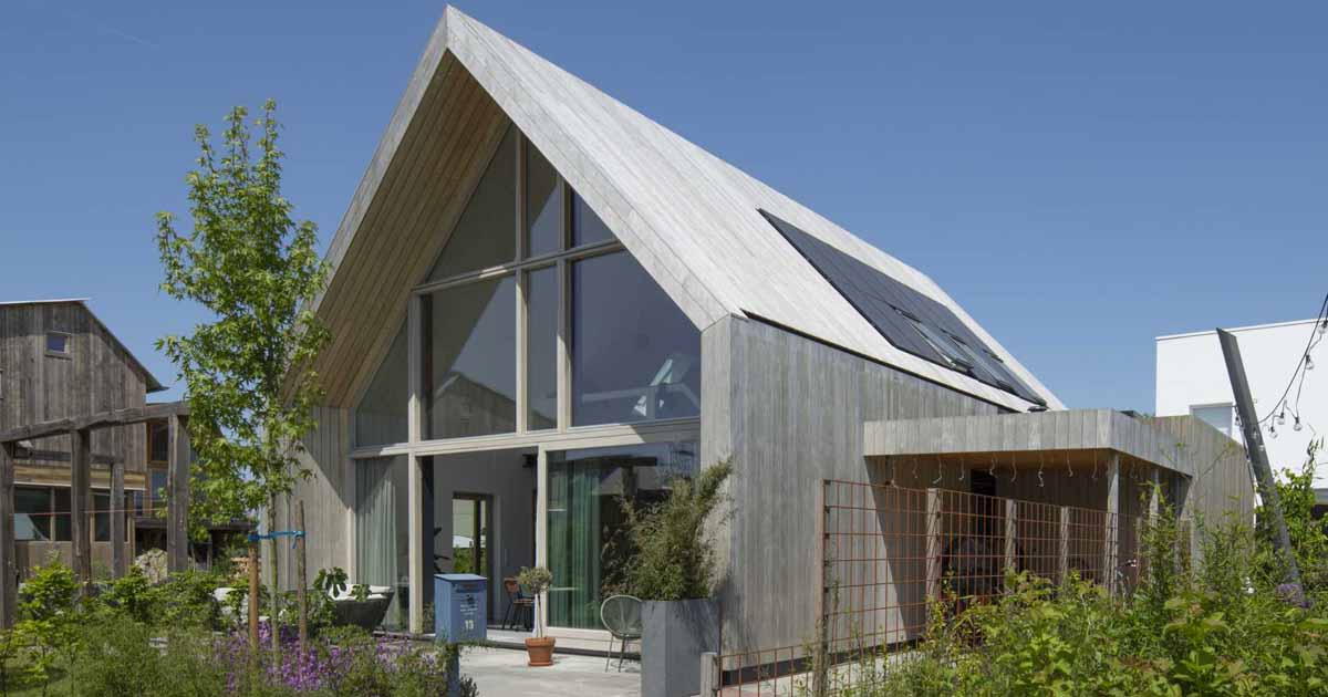 This Barn-Inspired Home Hides A Playroom With Climbing Wall Under Its Gable Roof