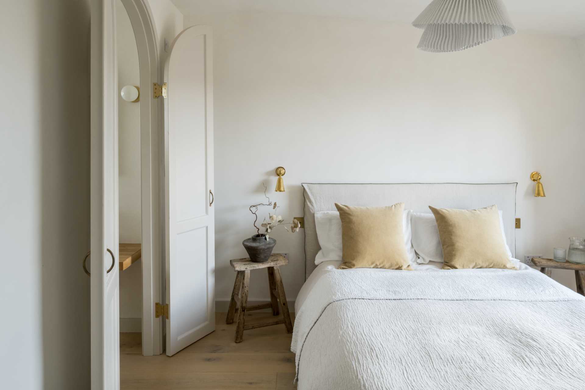 In this contemporary bedroom, there's a wood-lined window seat with storage below that overlooks the neighborhood.