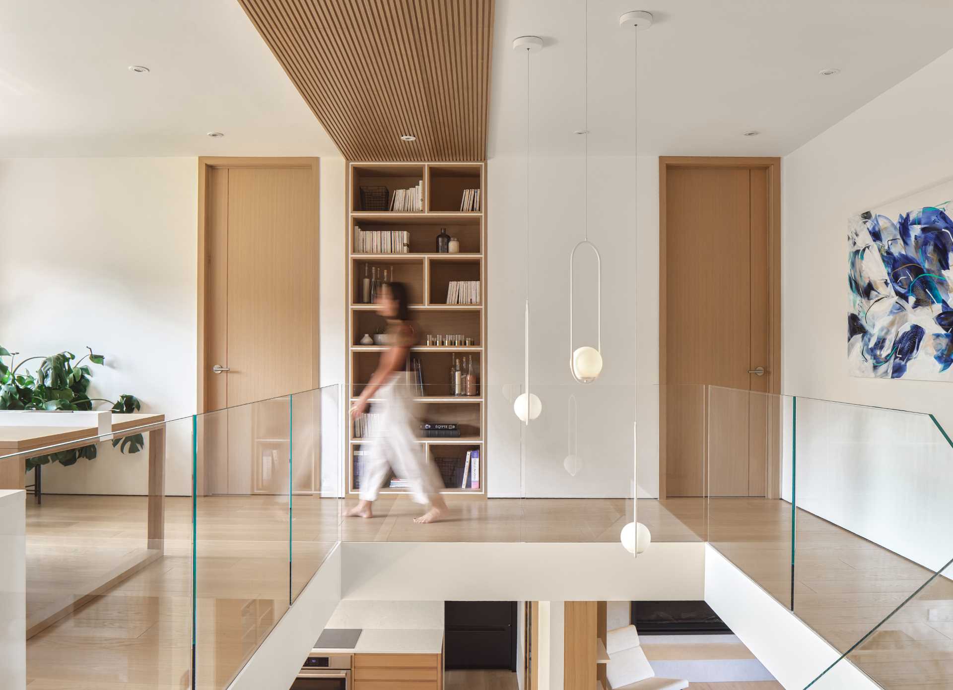 At the top of the stairs there's a home office, with built-in bookshelves and a desk.