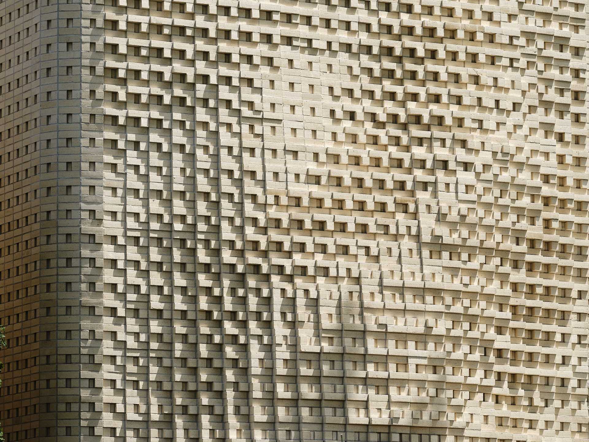 A sculptural brick facade for a single-family home in Toronto, Canada.