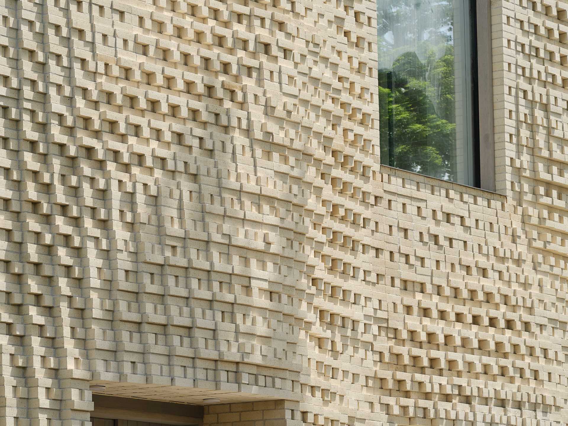 A sculptural brick facade for a single-family home in Toronto, Canada.