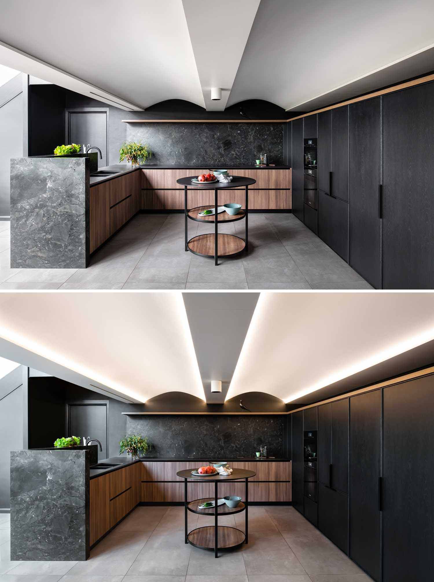 Plywood arches with LED lighting were added between the ceiling beams to create a sense of height in this renovated modern kitchen.