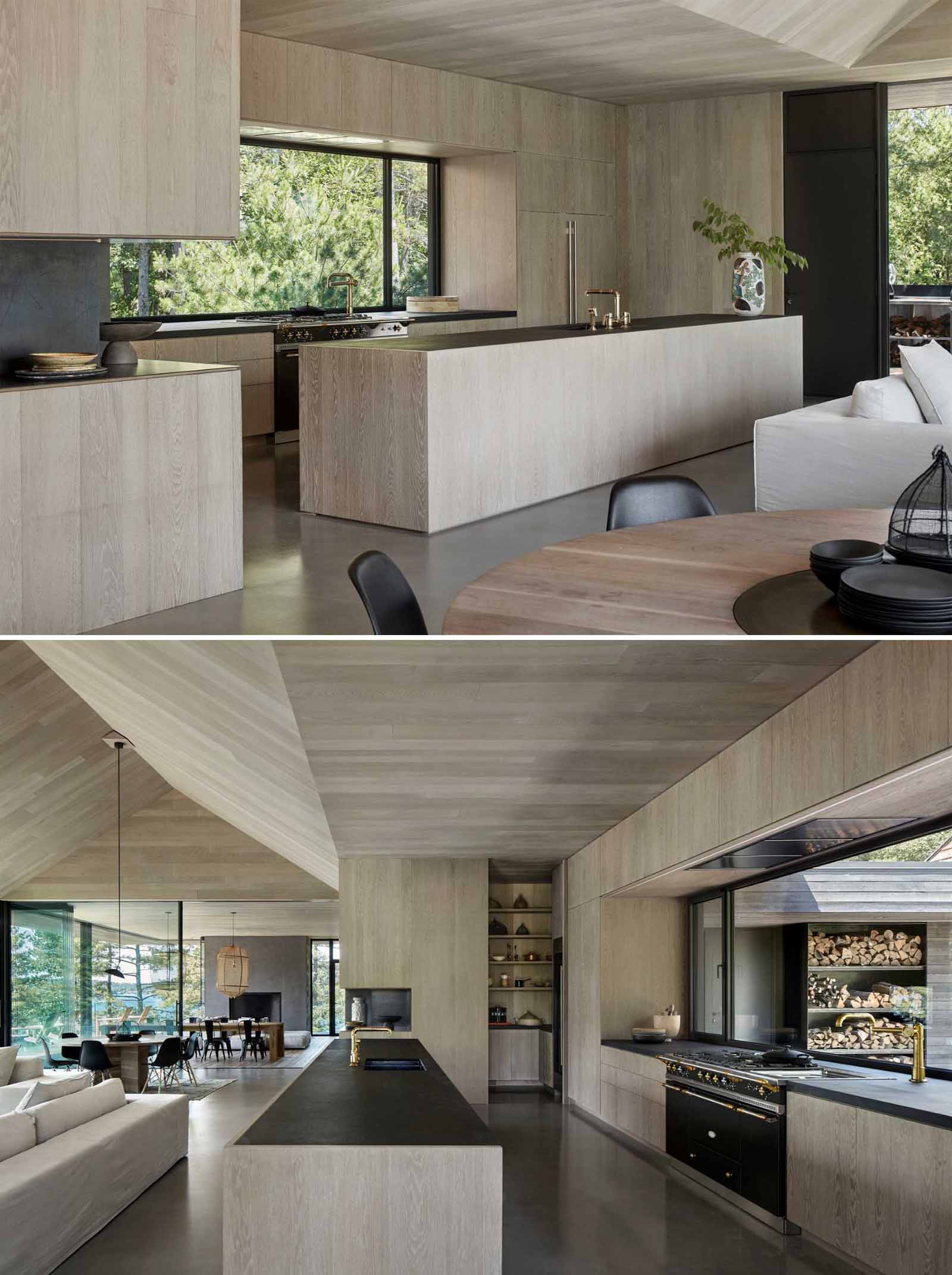 Modern kitchen cabinetry made to blend into the Oak wall boards, runs flush with the island's granite countertop.