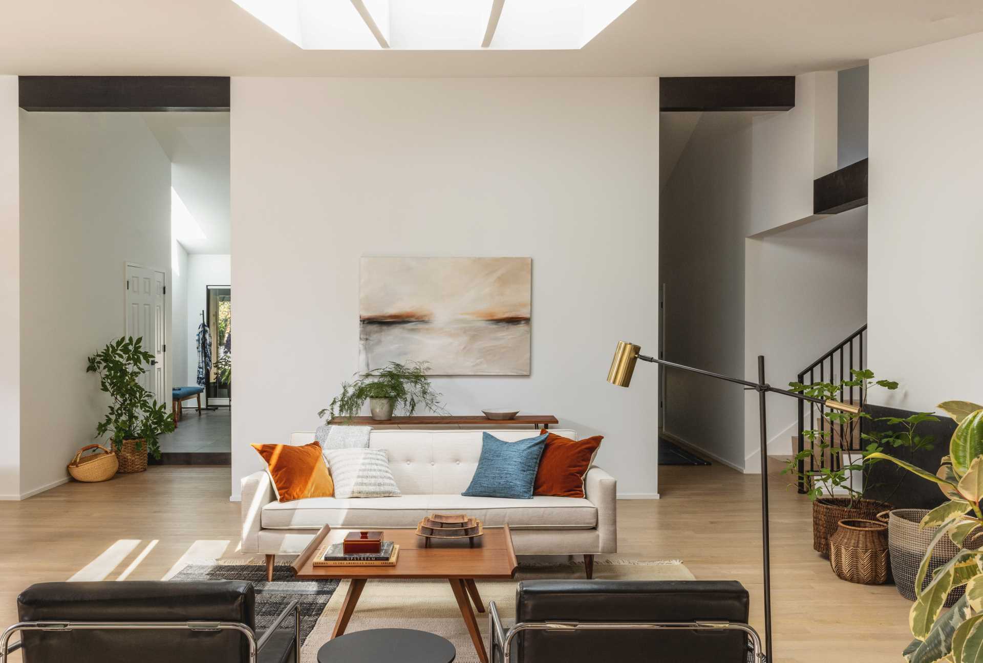 A modern living room with a skylight.