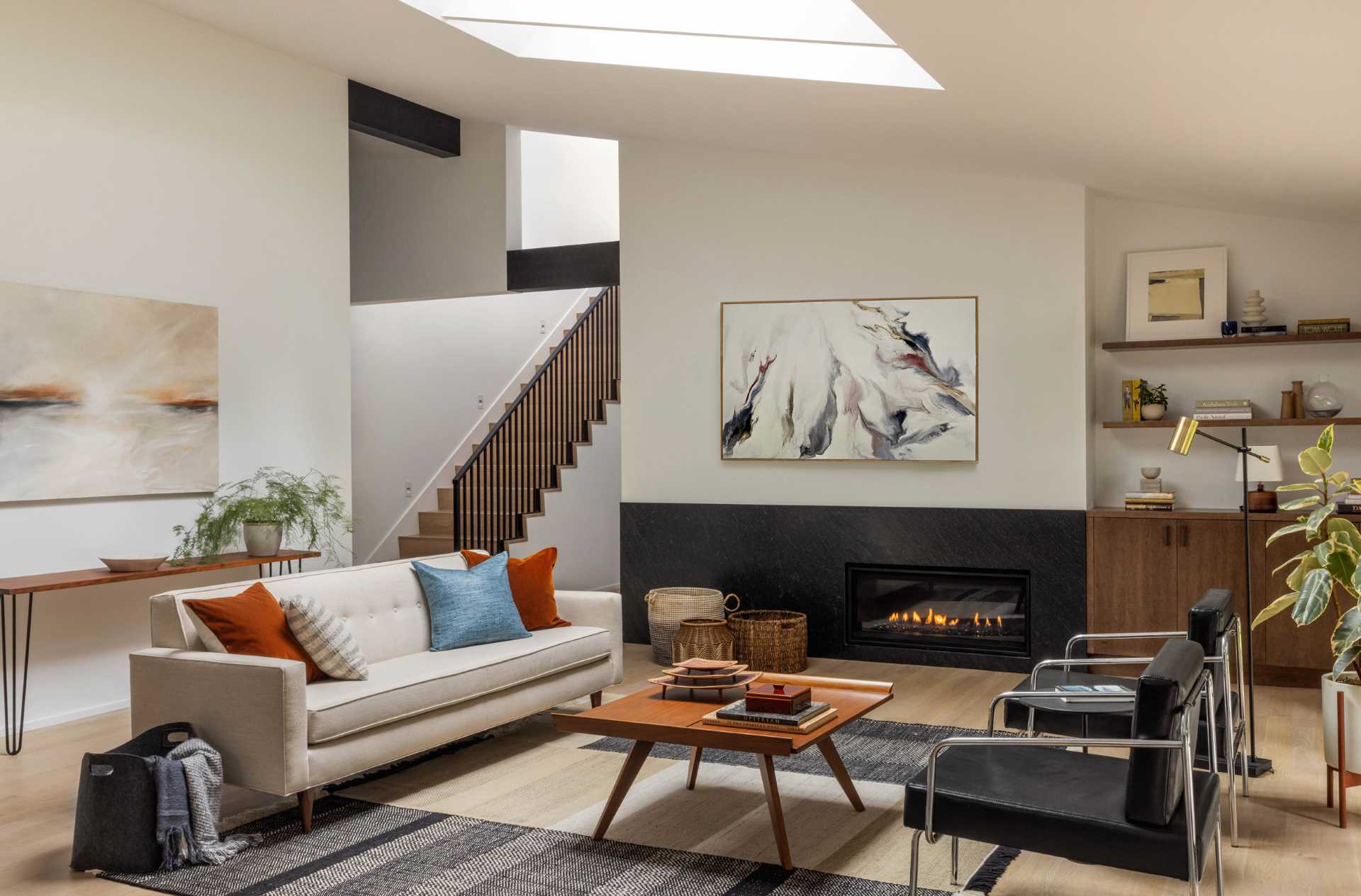 A modern living room with a skylight.
