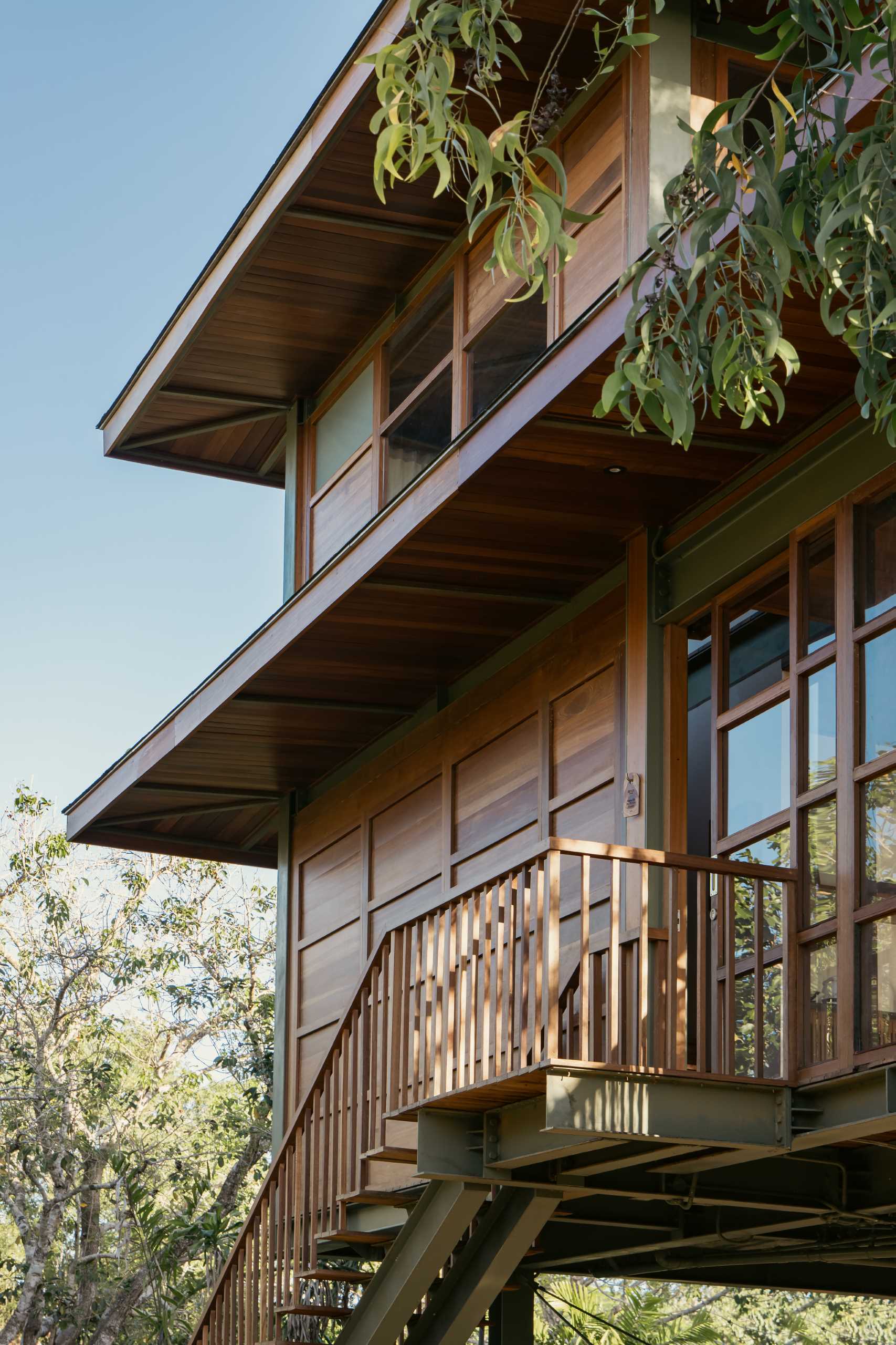 A modern two-storey, two-bedroom villa with exterior stairs that provide access to the interior.