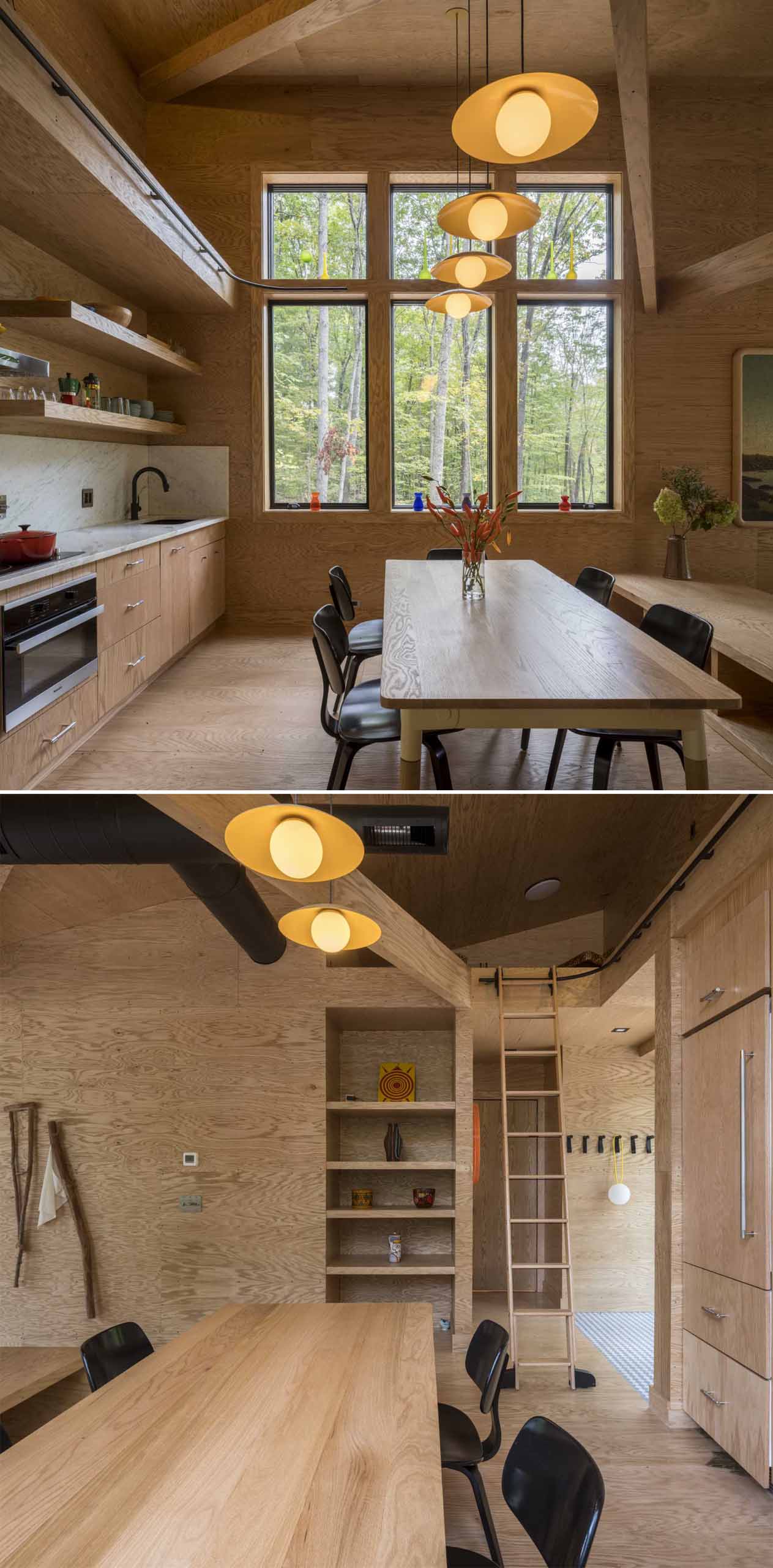 This cabin kitchen is located along the wall behind the dining area, while a ladder provides access to the upper loft area of the cabin.