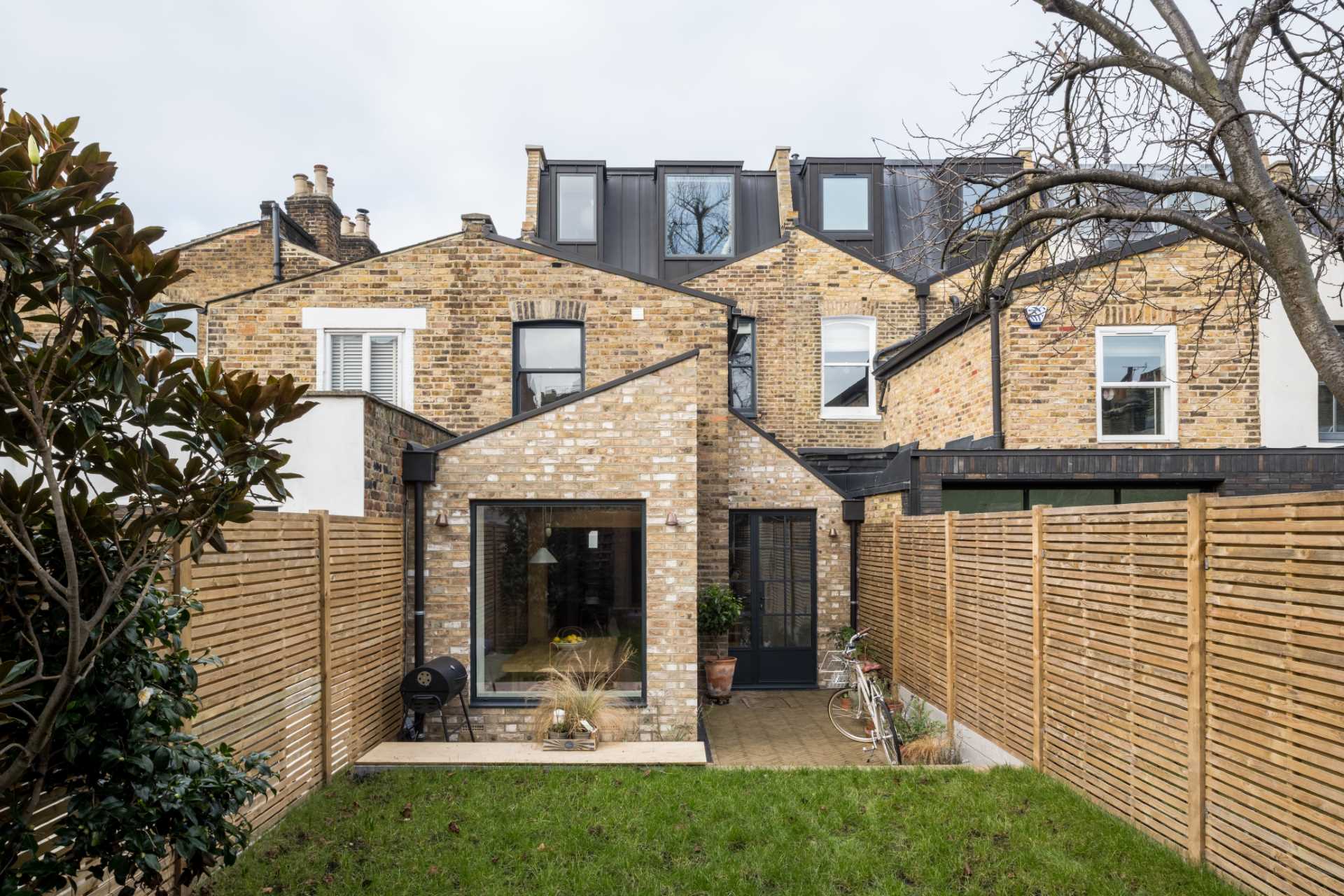 A Victorian terrace house renovation in London, England, that was designed with Italian charm, and centered around a sociable kitchen and its pantry.