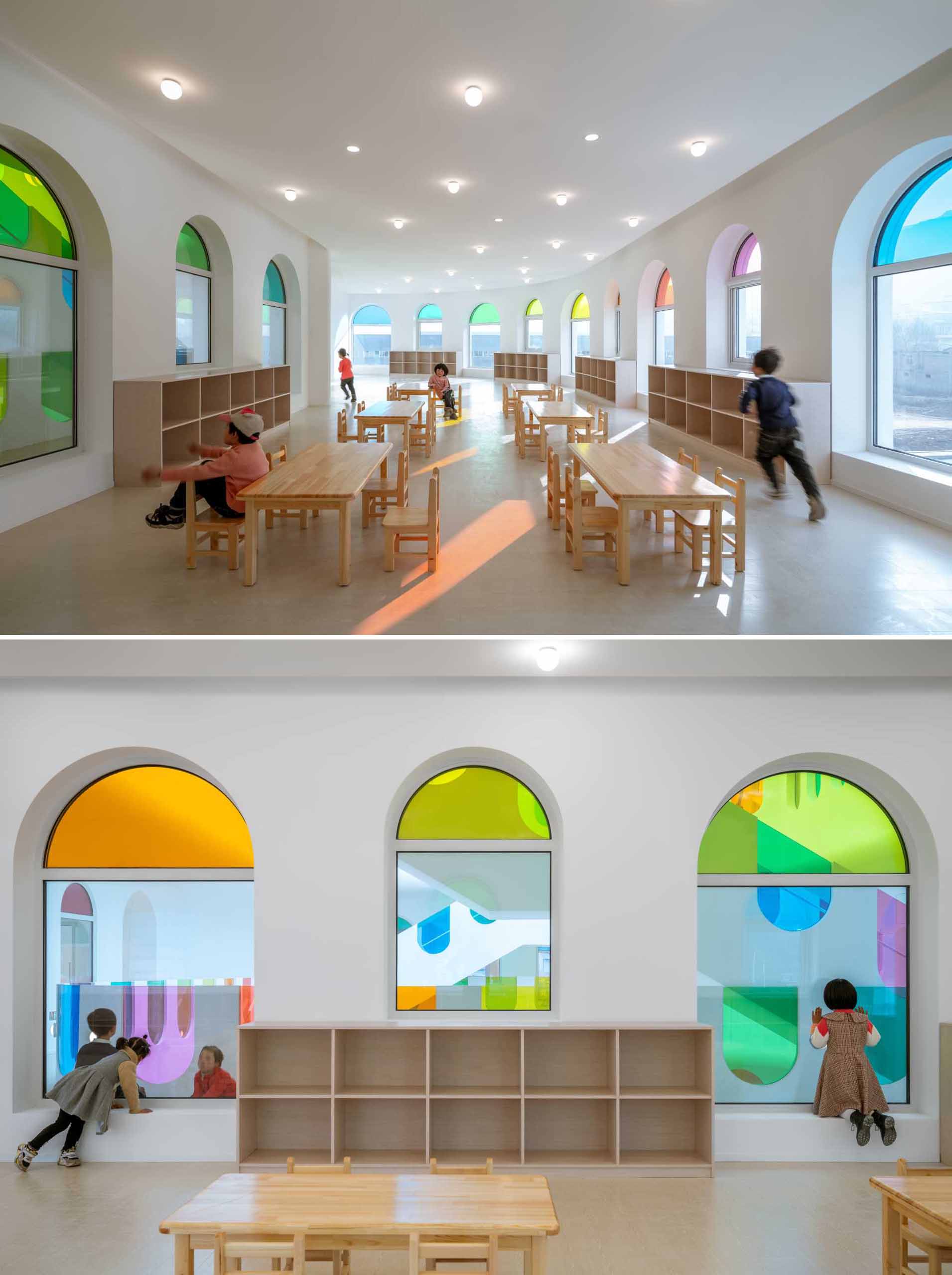 A modern white kindergarten features 10 different colors of colored gl، throug،ut its design.