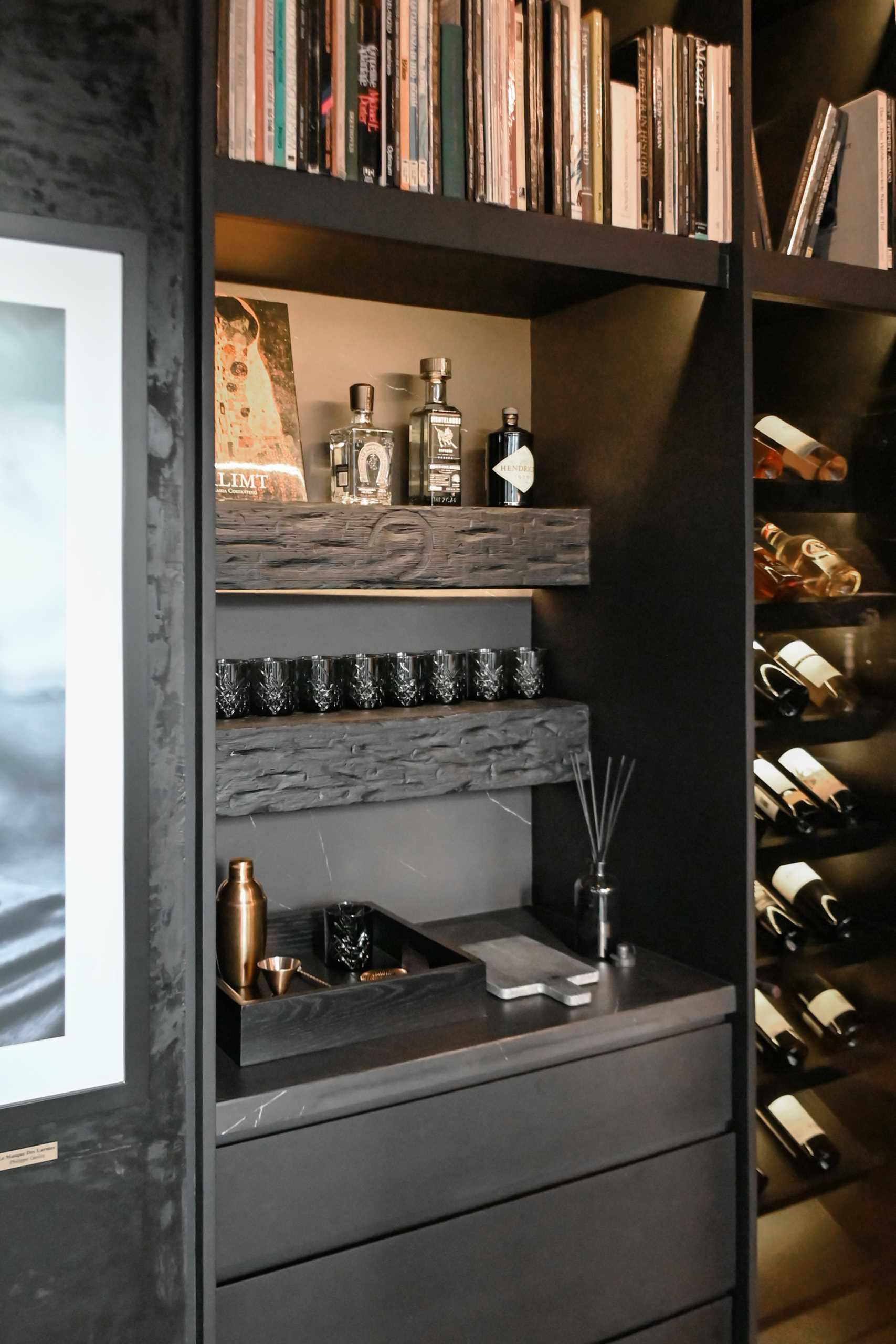 A modern black home bar and wine storage.